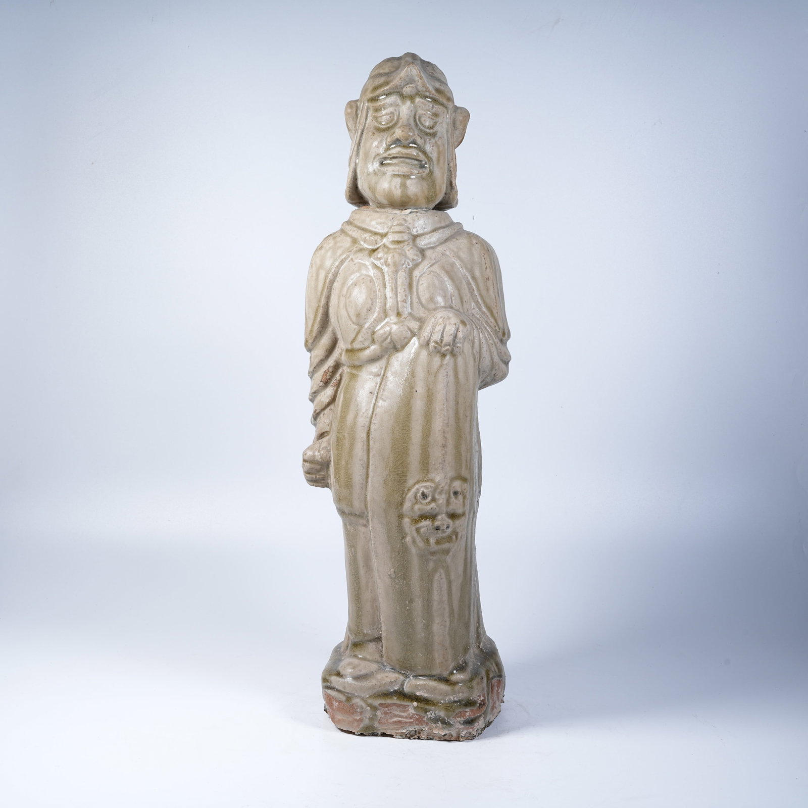 A CELADON WARRIOR FIGURINE (1 of 9)