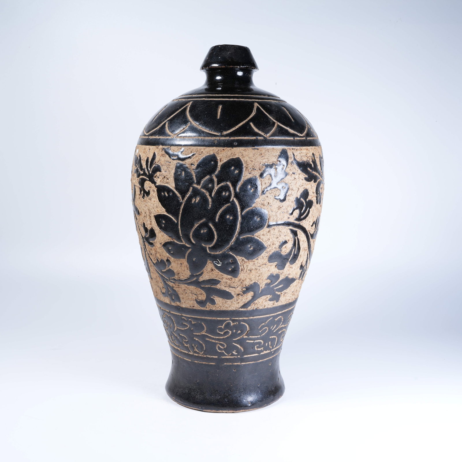 A CIZHOU KILN PRUNUS VASE WITH CARVED DECORATION: Cizhou Kiln Prunus Vase with Carved Decoration