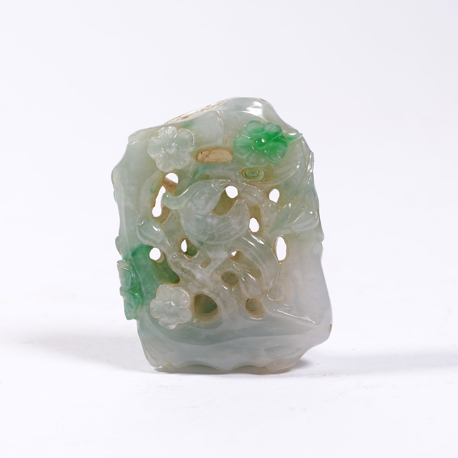 A JADEITE PENDANT WITH FLOWER AND BIRD PATTERNS: Jadeite Pendant with Flower and Bird Patterns