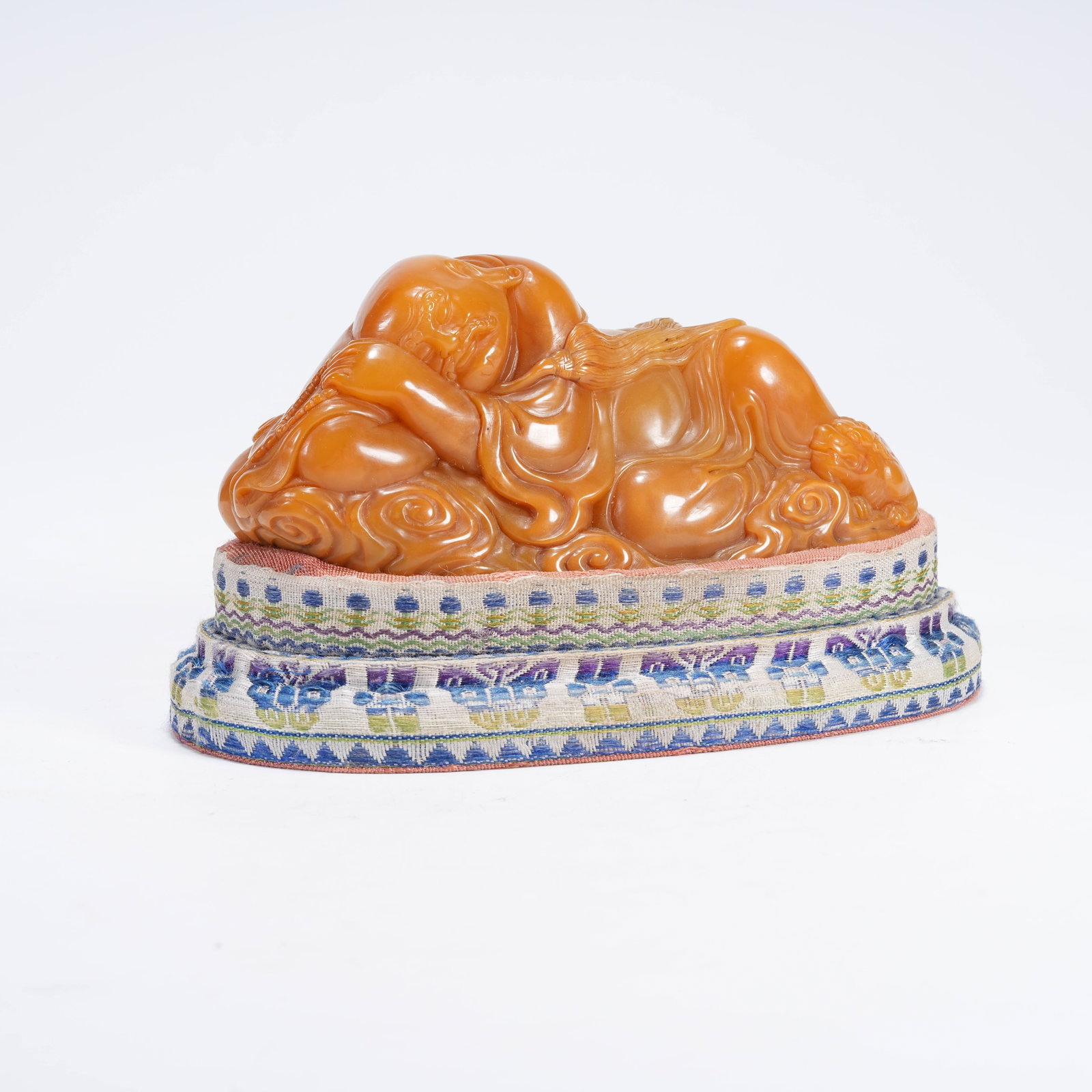 A SLEEPING ARHAT SHOUSHAN STONE ORNAMENT: Sleeping Arhat Shoushan Stone Ornament