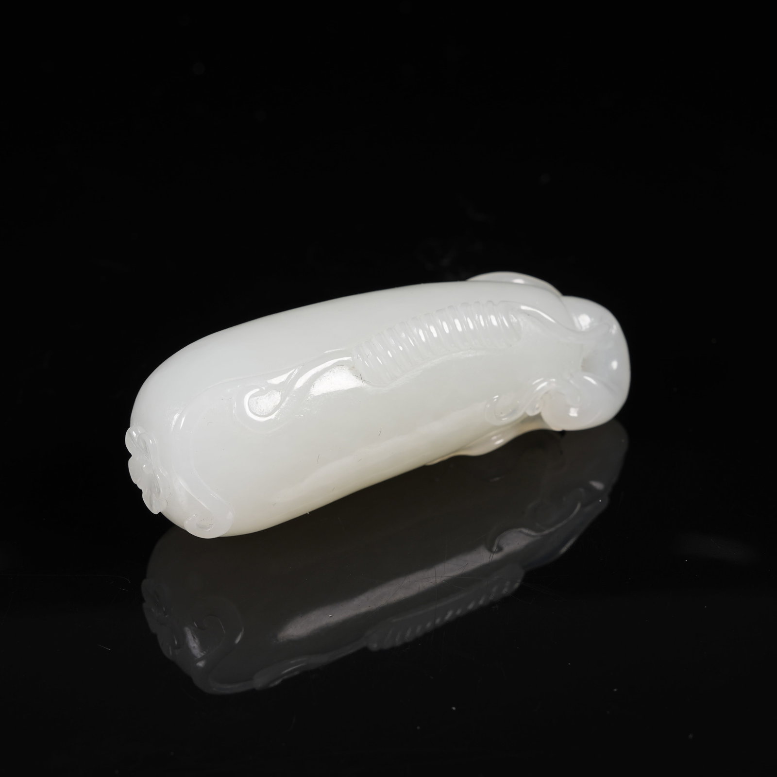 A WHITE HETIAN JADE PENDANT WITH AUSPICIOUS FRUIT PATTERNS: White Hetian Jade Pendant with Auspicious Fruit Patterns