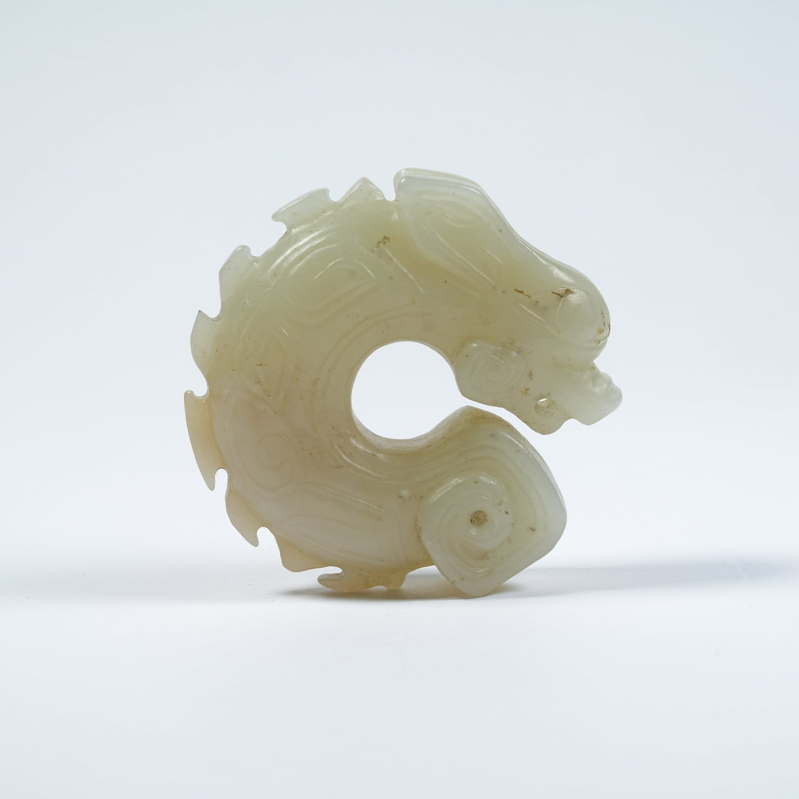A ANCIENT JADE C-SHAPED DRAGON PENDANT (1 of 10)