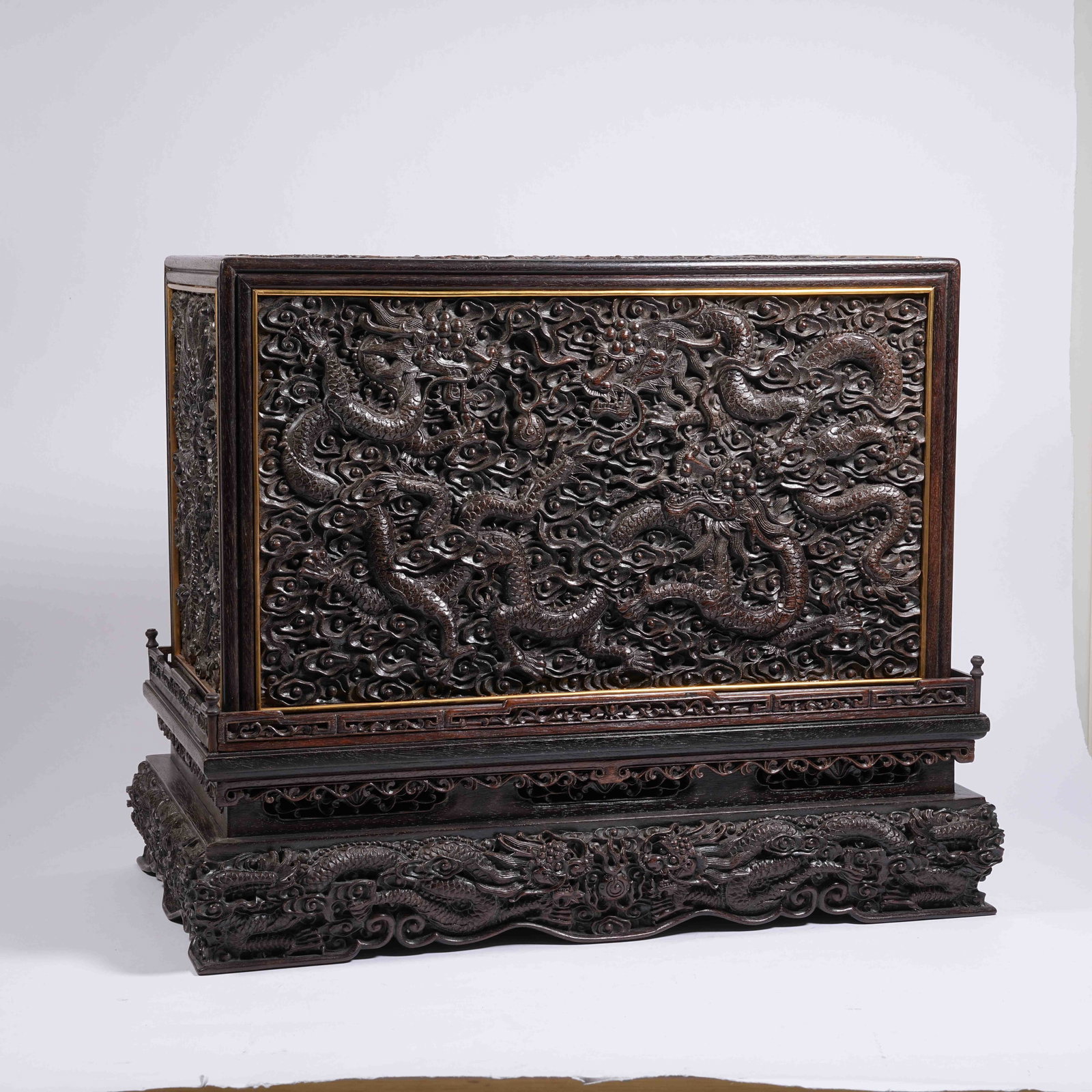 A RED SANDALWOOD COVERED BOX WITH CLOUD AND DRAGON PATTERNS: Red Sandalwood Covered Box with Cloud and Dragon Patterns
