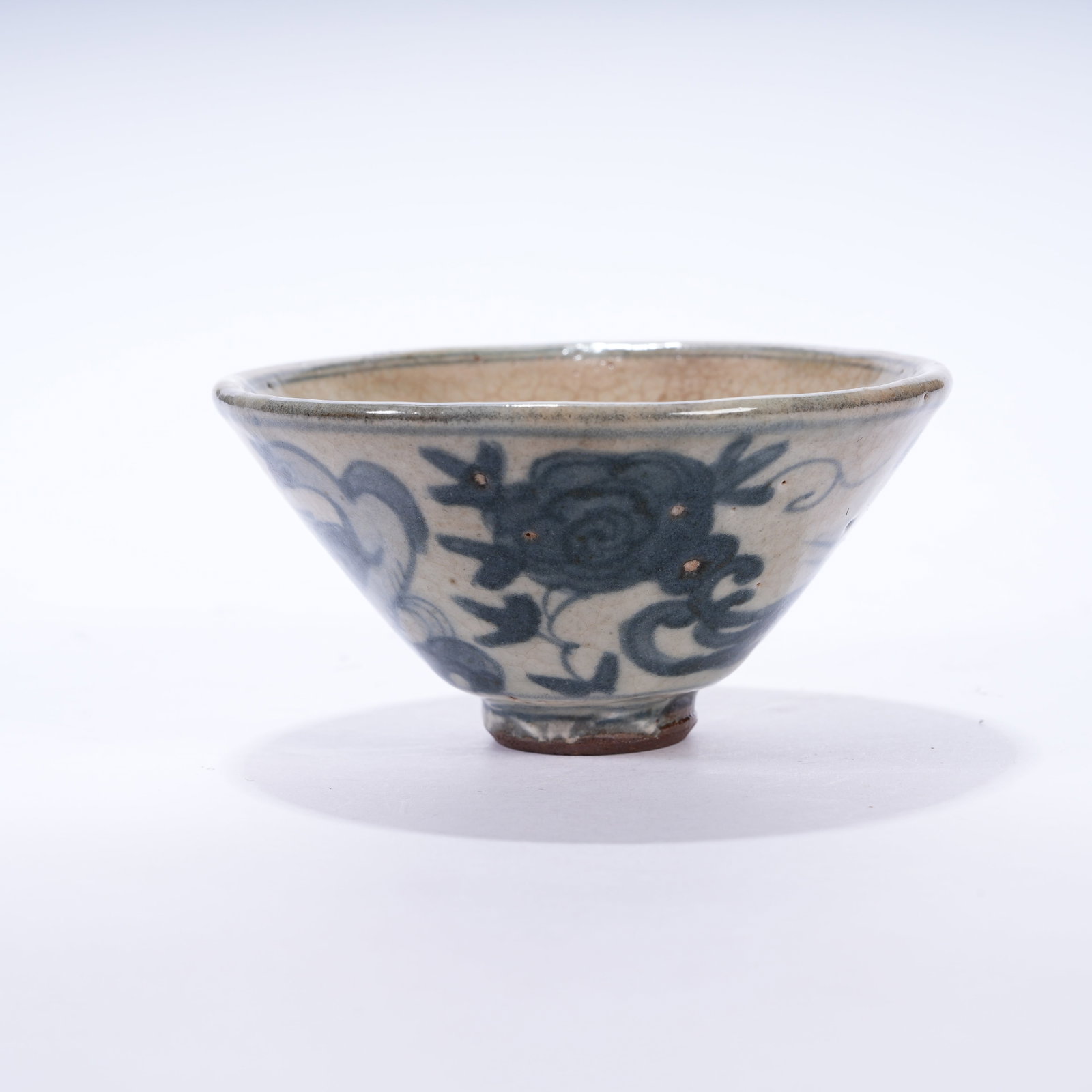 A BLUE AND WHITE CUP WITH PHOENIX AMIDST FLORAL SCROLLS PATTERNS: Blue and White Cup with Phoenix Amidst Floral Scrolls Patterns