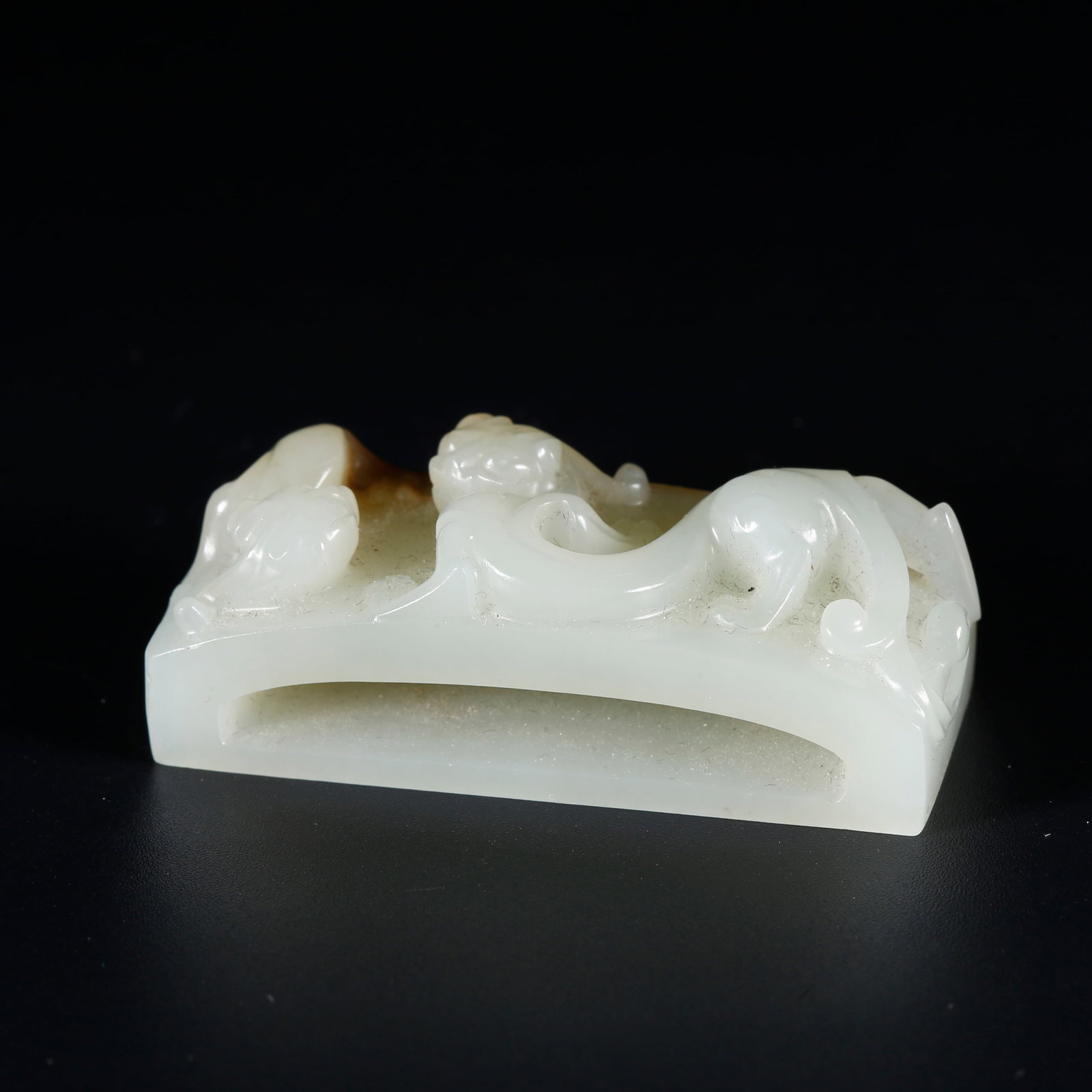A HETIAN JADE SWORD FITTING CARVED WITH DRAGON PATTERN (1 of 8)