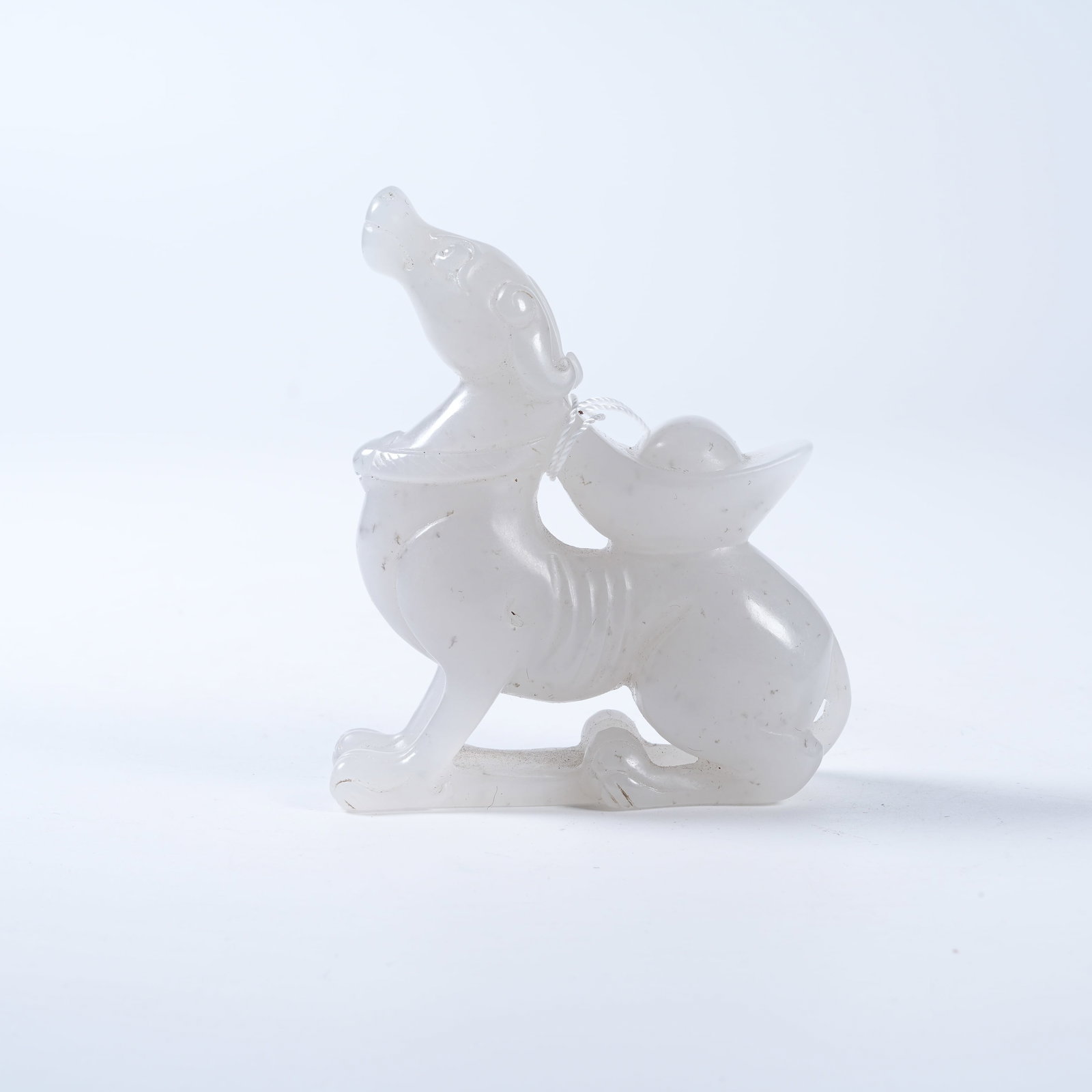 A HETIAN JADE ORNAMENT OF DIVINE HOUND DELIVERING WEALTH: Hetian Jade Ornament of Divine Hound Delivering Wealth