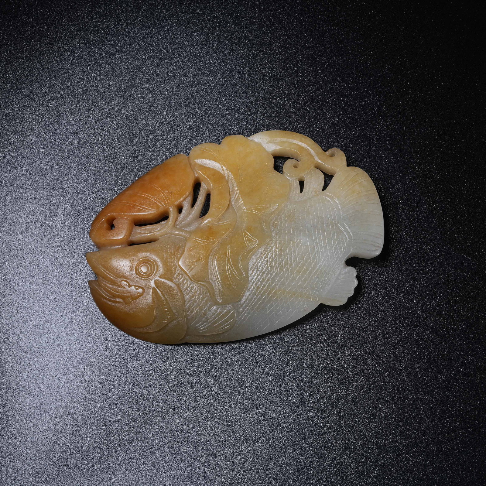A HETIAN JADE HANGING ORNAMENT SYMBOLIZING ABUNDANT SURPLUS YEAR AFTER YEAR: Hetian Jade Hanging Ornament Symbolizing Abundant Surplus Year After Year