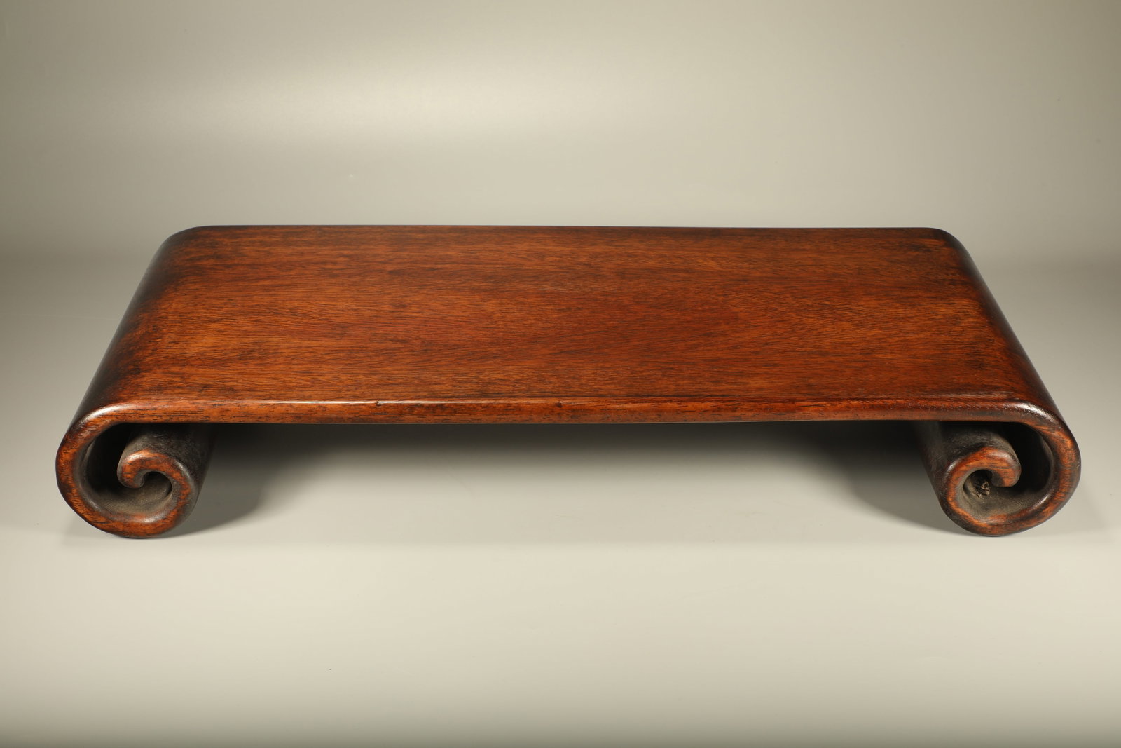 A PADAUK LOWER SCROLL SIDE TABLE - 3