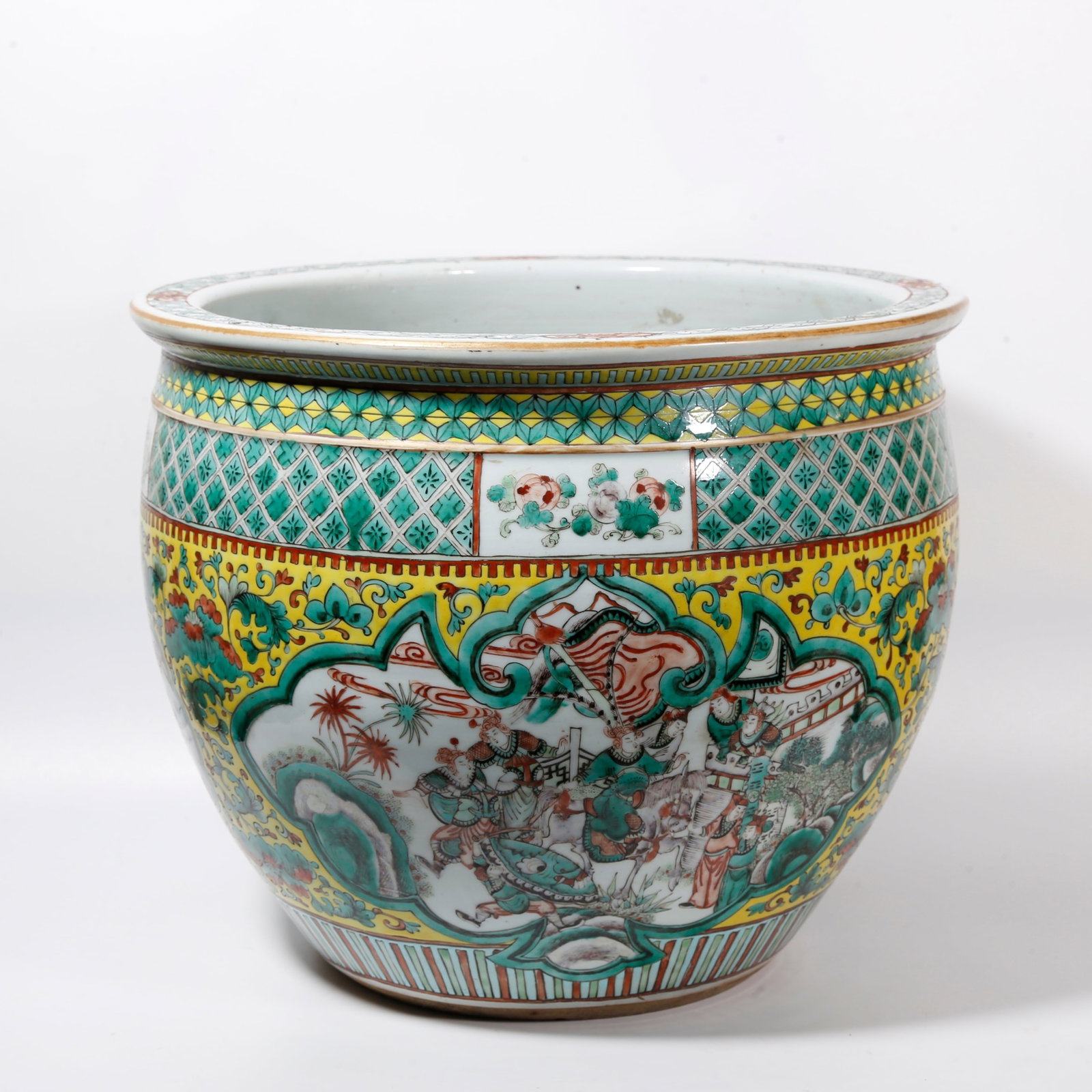 A YELLOW GROUND DESK BASIN WITH RESERVED PANELS OF WUCAI NARRATIVE FIGURE PATTERNS: Yellow Ground Desk Basin with Reserved Panels of Wucai Narrative Figure Patterns