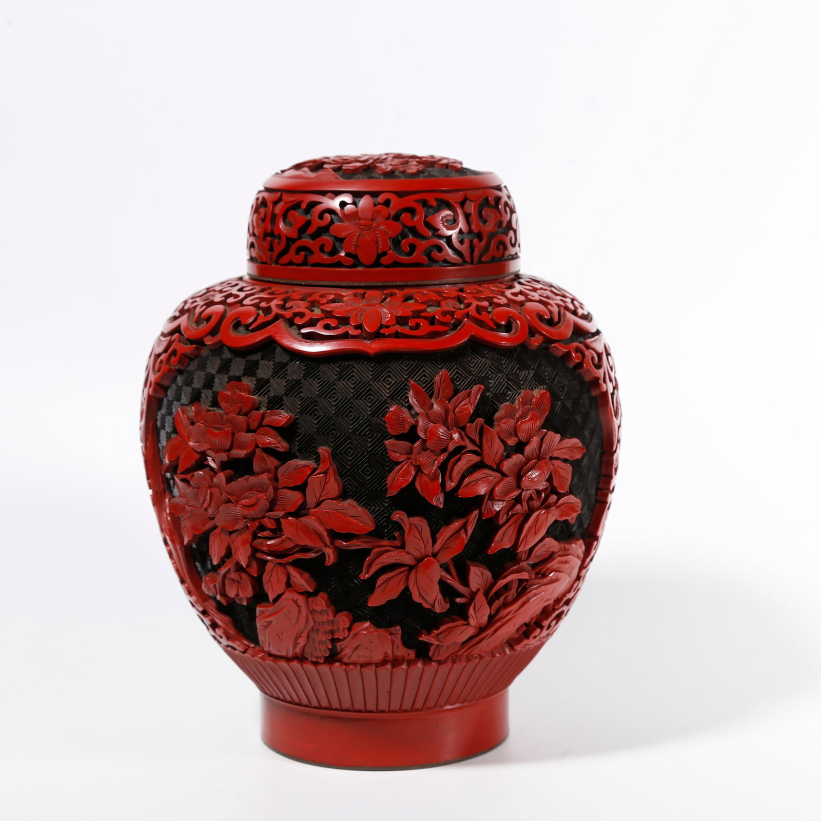 A CARVED RED LACQUER COVERED JAR WITH FLORAL PATTERNS (1 of 11)
