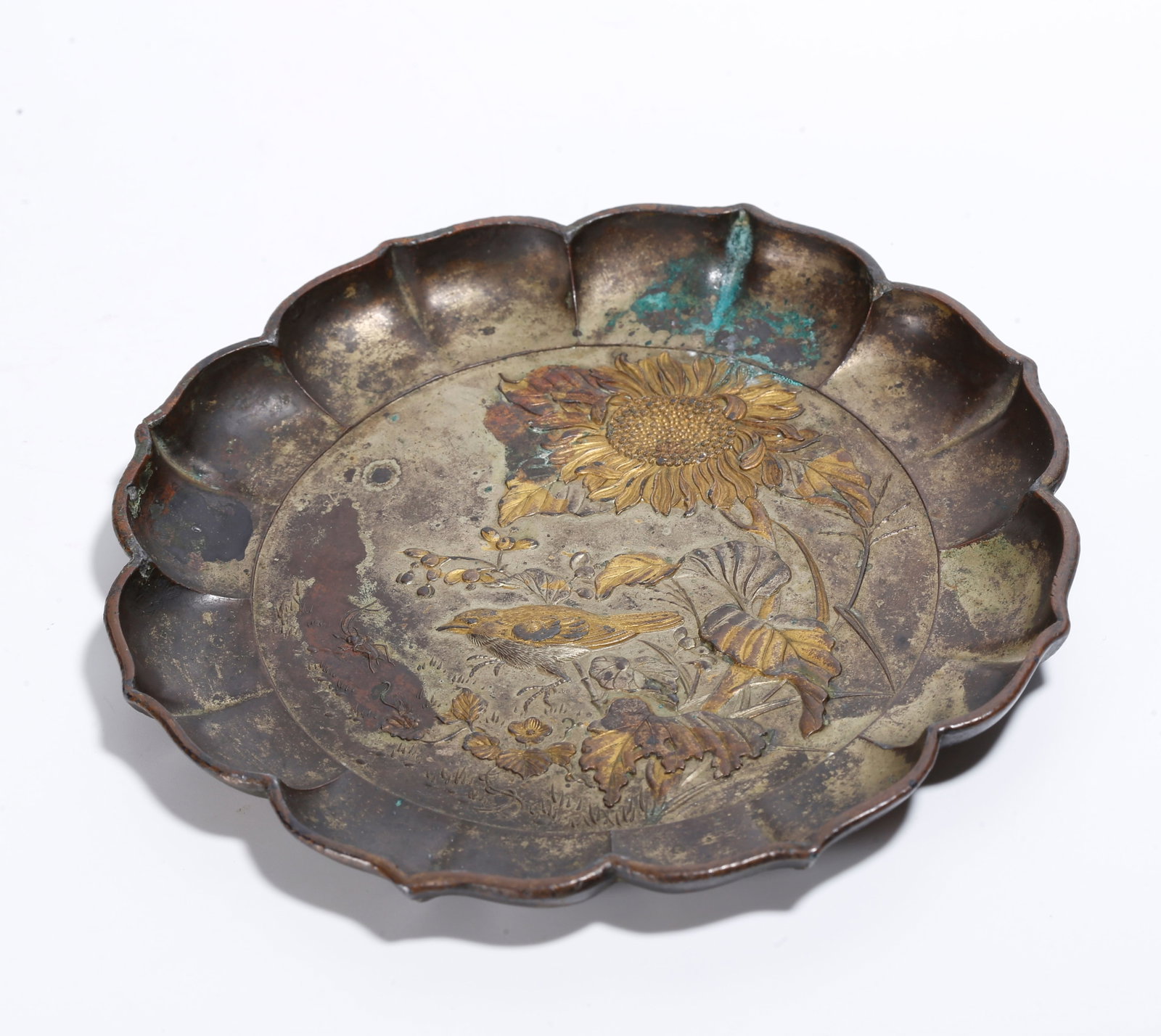 A PARTIALLY GILT BRONZE RHOMBIC RIM PLATE WITH FLOWER AND BIRD PATTERN: Partially Gilt Bronze Rhombic Rim Plate with Flower and Bird Pattern