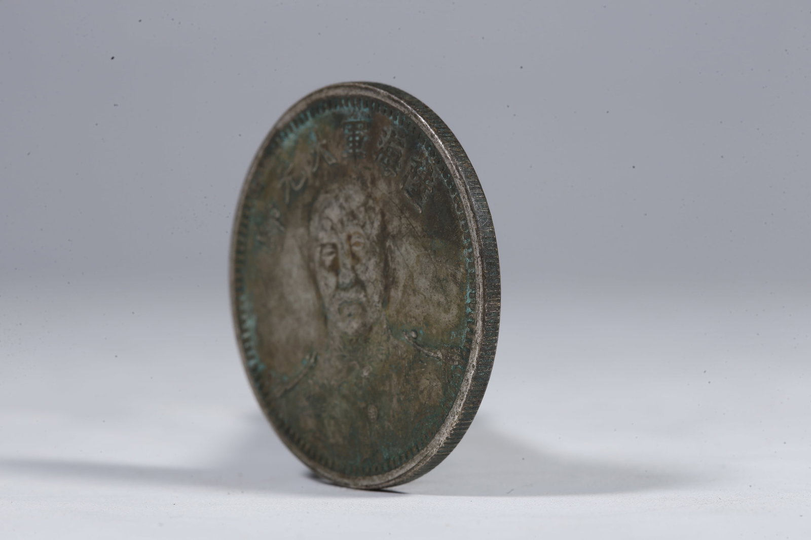 A SILVER DOLLAR COIN - 2