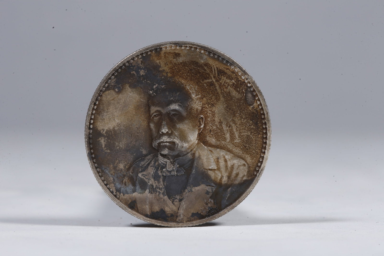 A SILVER DOLLAR COIN - 3