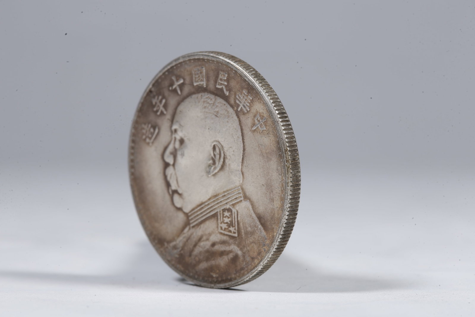 A SILVER DOLLAR COIN - 2