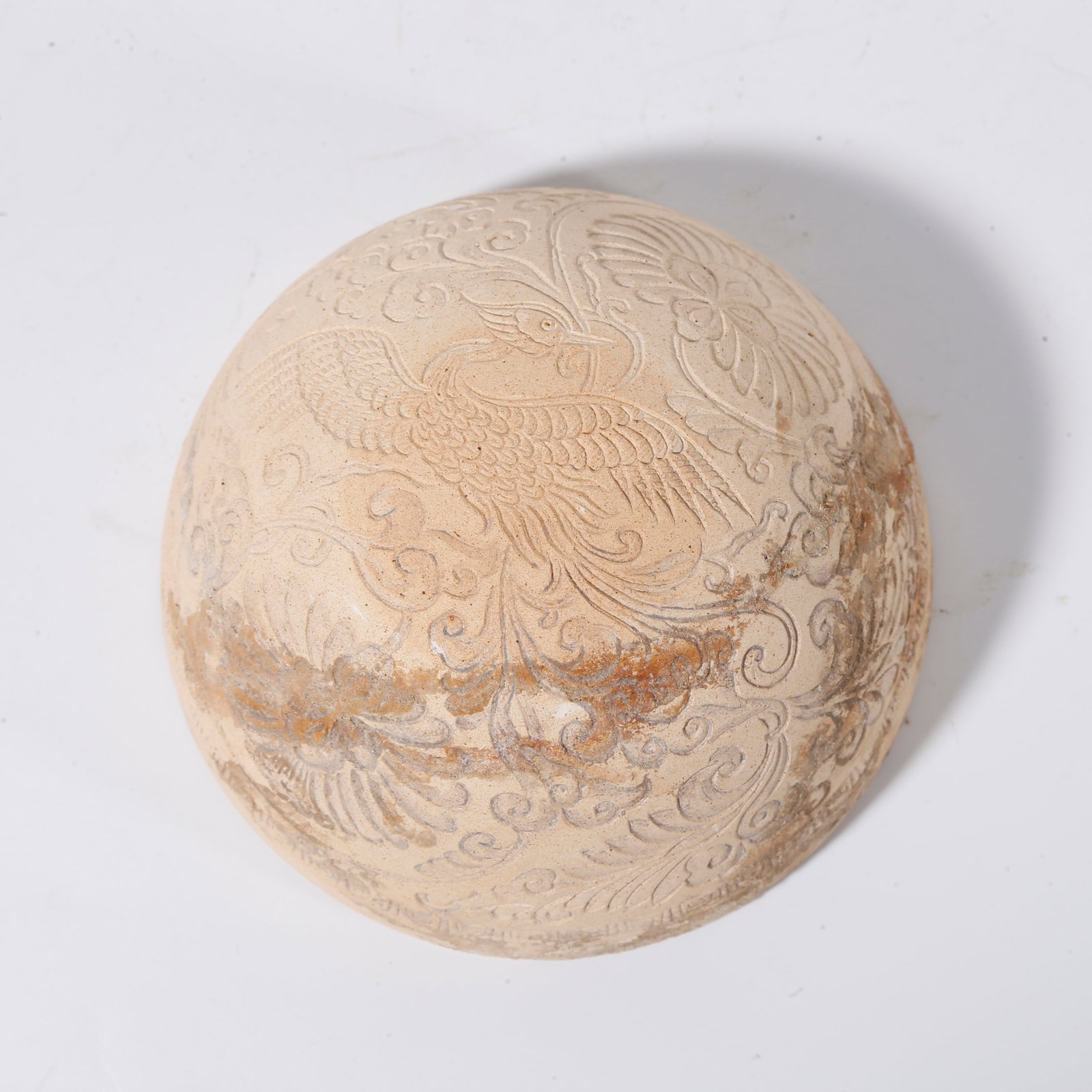 A POTTERY MOULD WITH PHOENIX AMID FLORAL SCROLLS PATTERN: Pottery mould with phoenix amid floral scrolls pattern