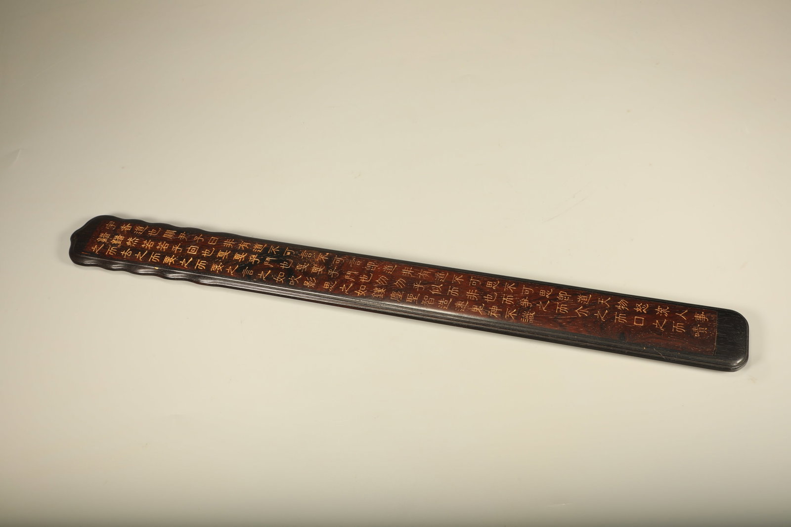 A SANDALWOOD RULER INLAID WITH HUANGHUALI WITH INSCRIBED VERSES AND GILDED TRACES: Sandalwood Ruler Inlaid with Huanghuali with Inscribed Verses and Gilded Traces