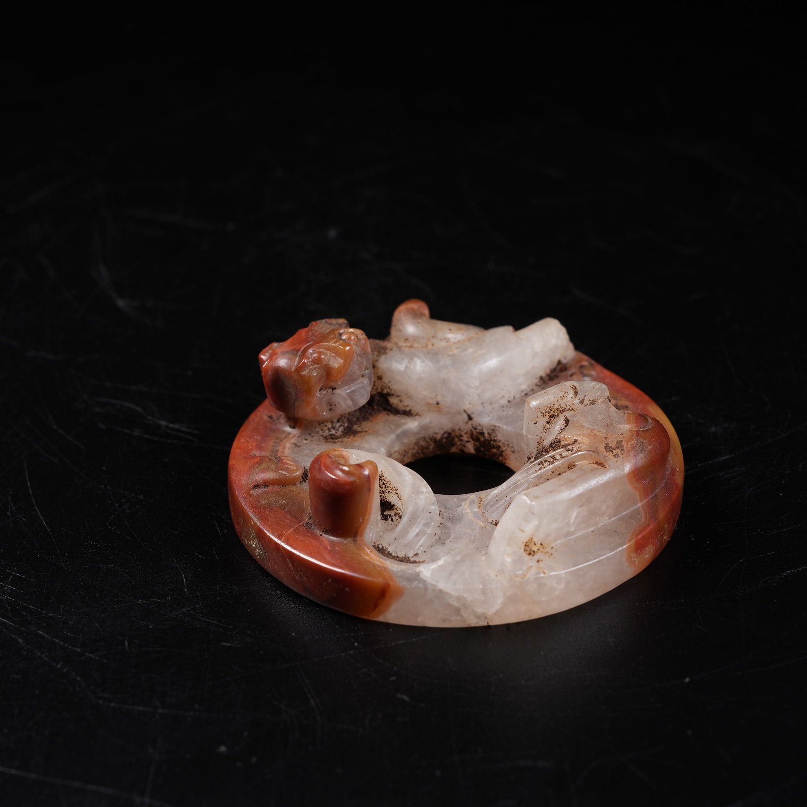 A WARRING STATES RED AGATE BI DISC WITH CHI DRAGON PATTERN (1 of 8)