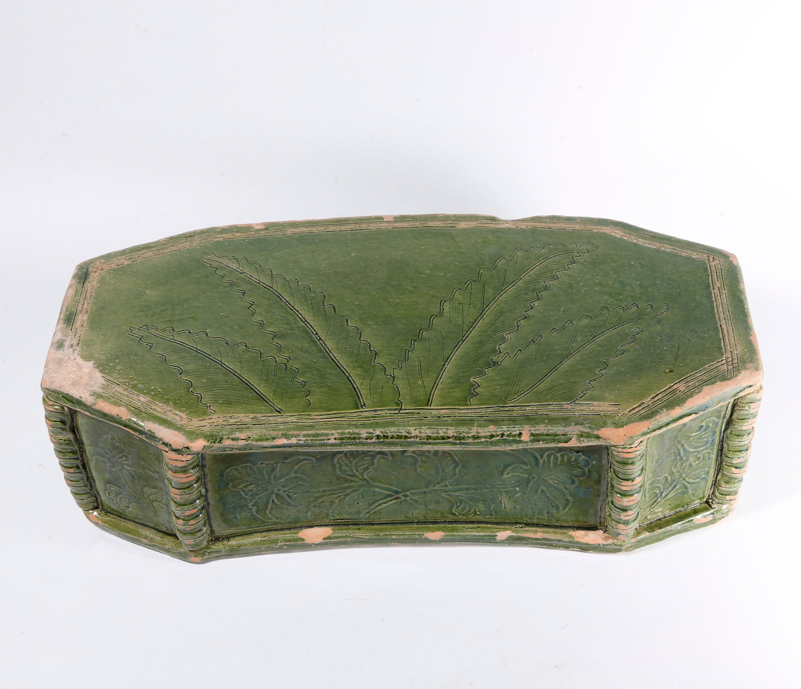 A GREEN-GLAZED FLOWER-PATTERN PILLOW (1 of 10)