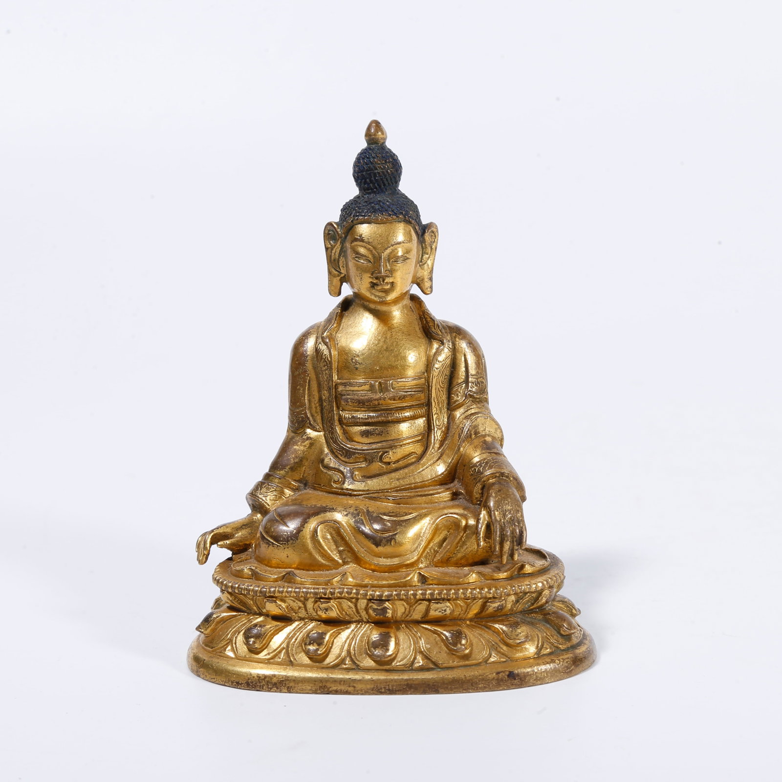 A GILT-BRONZE BUDDHA STATUE: Gilt-bronze Buddha statue