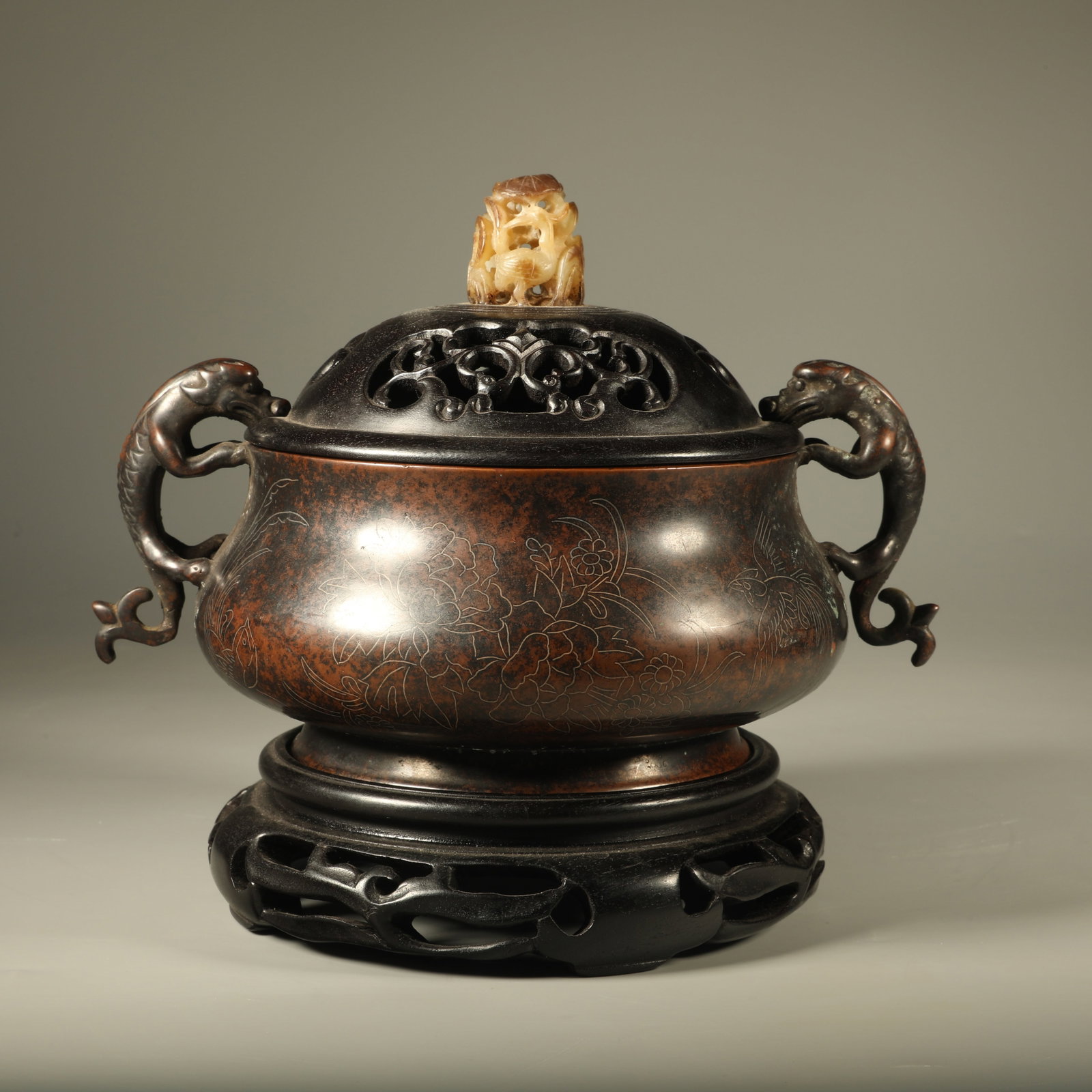A BRONZE CENSER WITH SILVER-WIRE INLAID FLOWER-AND-BIRD MOTIFS AND CHILONG HANDLES: Bronze Censer with Silver-wire Inlaid Flower-and-bird Motifs and Chilong Handles