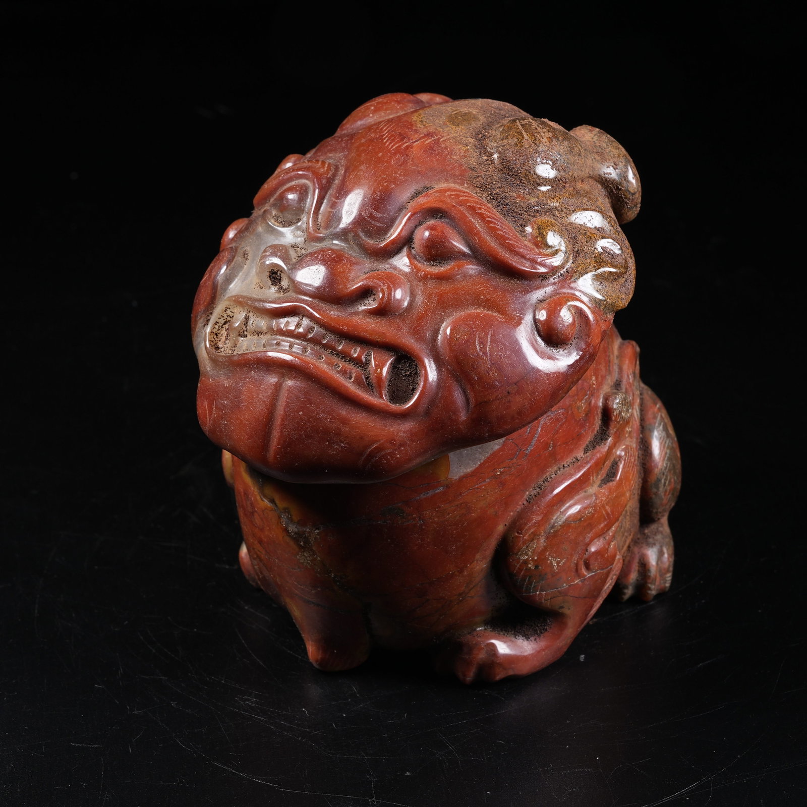 A WARRING STATES RED AGATE INCENSE BURNER WITH DIVINE MASK MOTIF: Warring States Red Agate Incense Burner with Divine Mask Motif