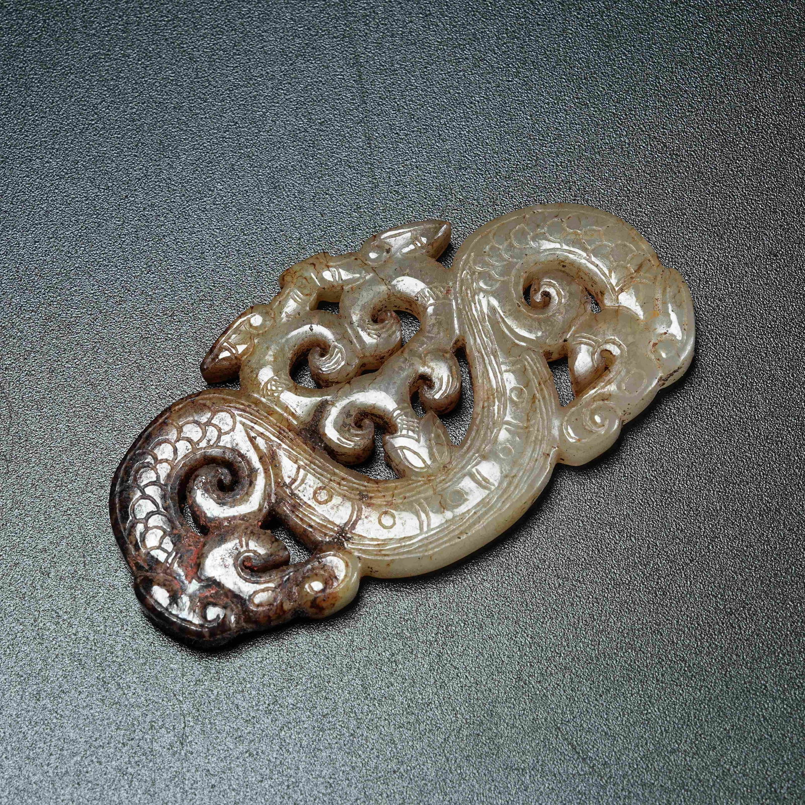 A ANCIENT JADE PENDANT WITH DRAGON PATTERN: Ancient Jade Pendant with Dragon Pattern