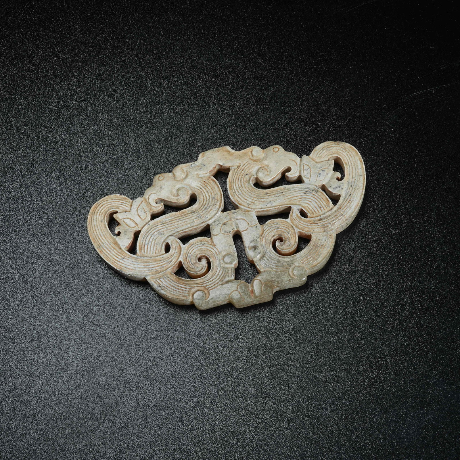 A ANCIENT JADE ASSEMBLED PENDANT SET CARVED WITH DRAGON PATTERNS: Ancient Jade Assembled Pendant Set Carved with Dragon Patterns