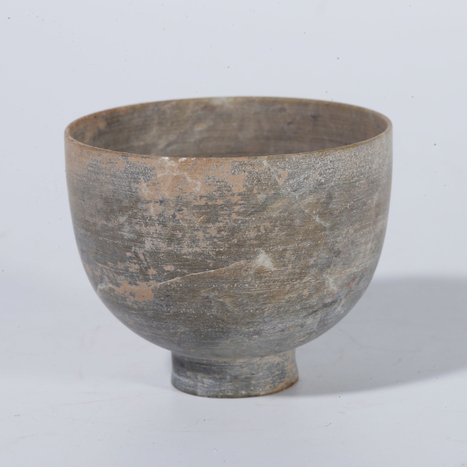 A LEOPARD-SPOT STONE CUP (1 of 9)
