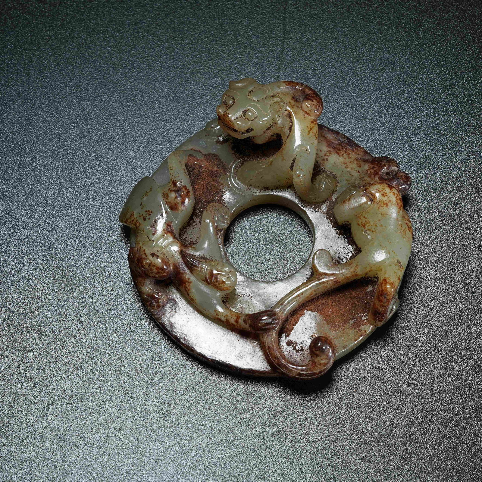 A ANCIENT JADE SURROUNDING BI DISC WITH CHI DRAGON PATTERN: Ancient Jade Surrounding Bi Disc with Chi Dragon Pattern