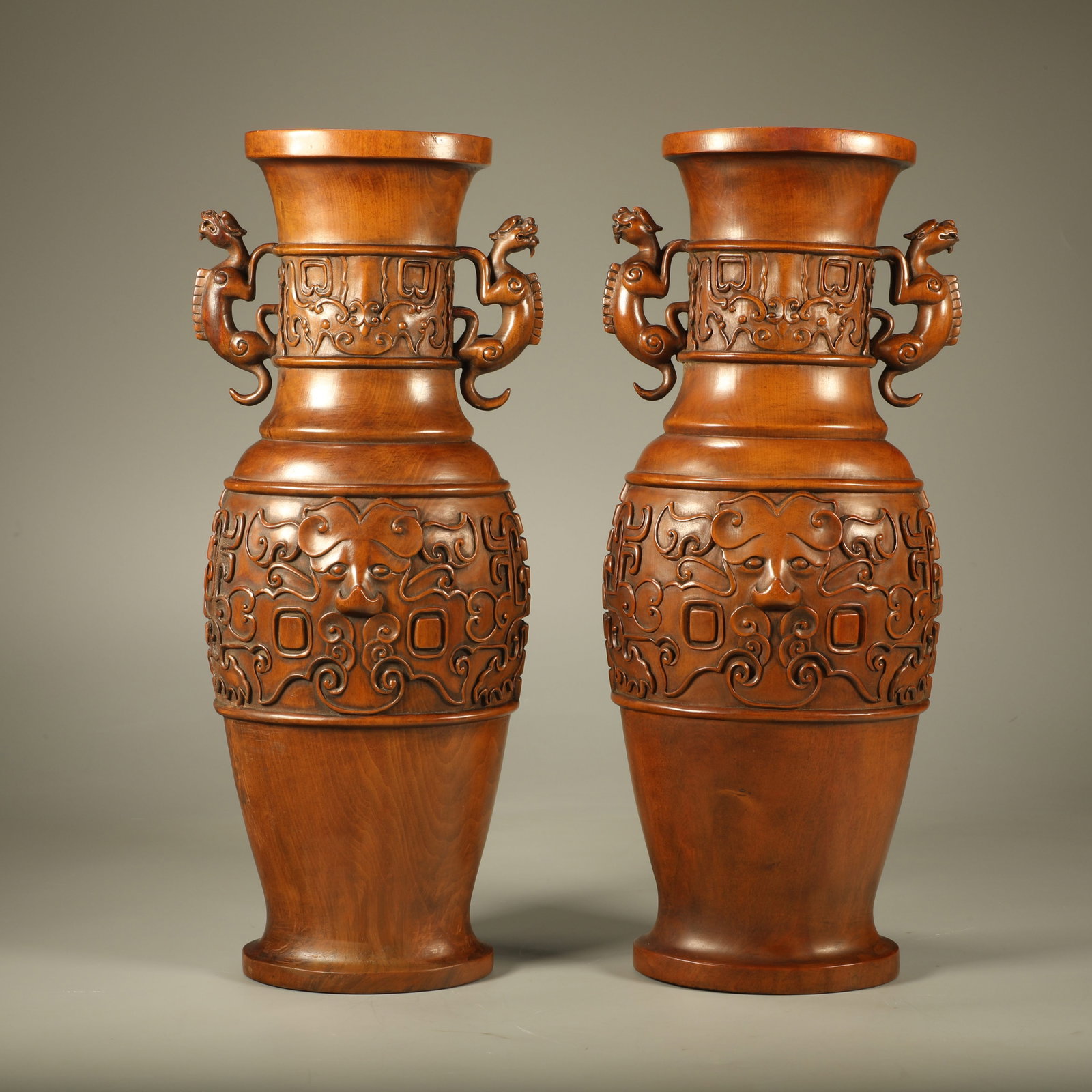 A PAIR OF BOXWOOD VASES WITH DRAGON CARVINGS: Pair of Boxwood Vases with Dragon Carvings
