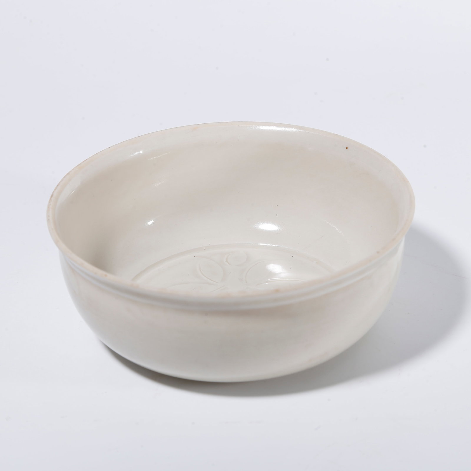 A DING WARE BOWL WITH FLORAL PATTERN: Ding ware bowl with floral pattern