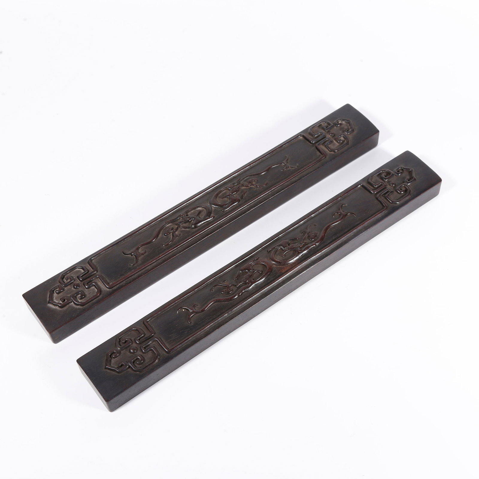 A DRAGON-PATTERN PAPERWEIGHT CARVED IN ZITAN WOOD (PAIR) (1 of 8)