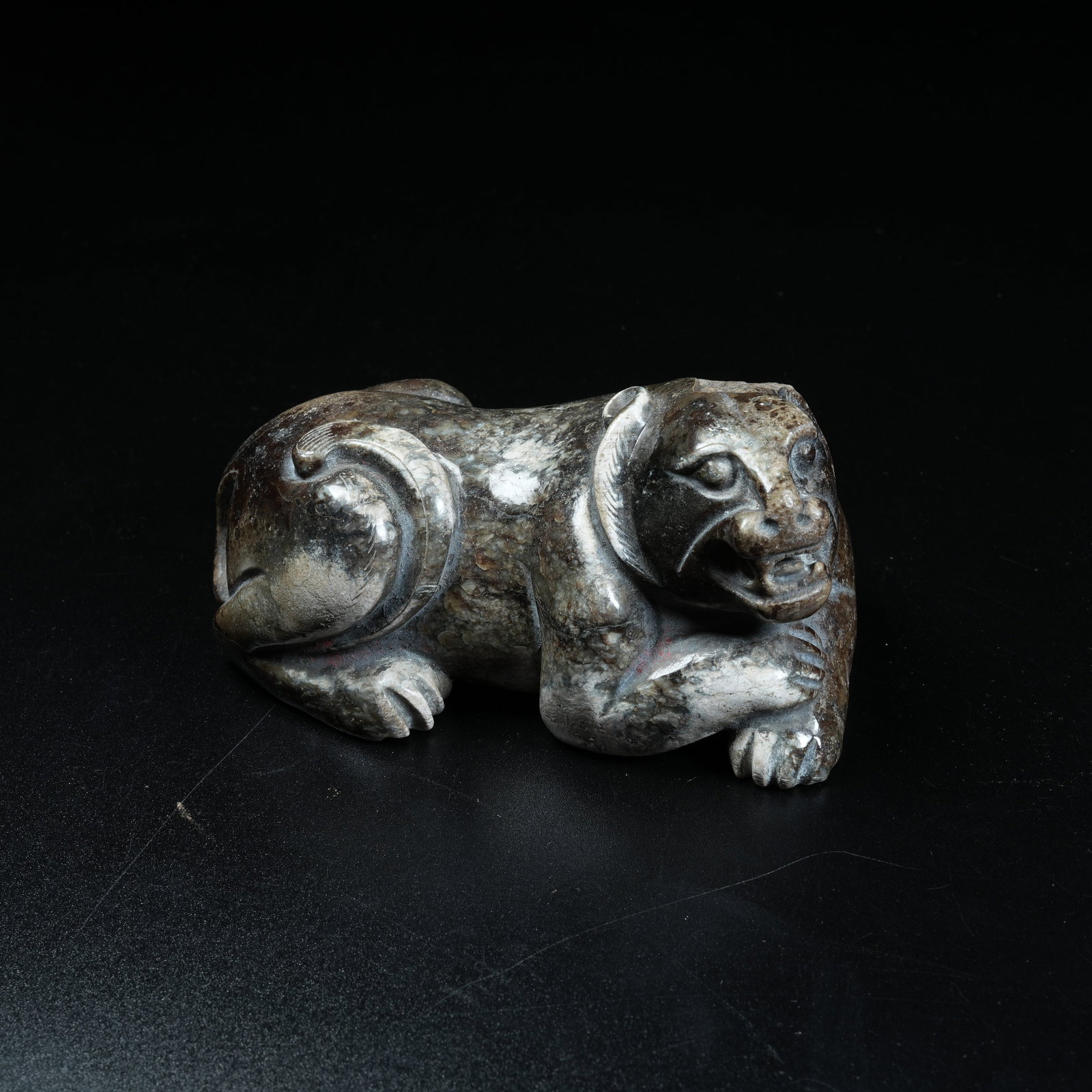 A ANCIENT JADE RECLINING BEAR ORNAMENT (1 of 8)
