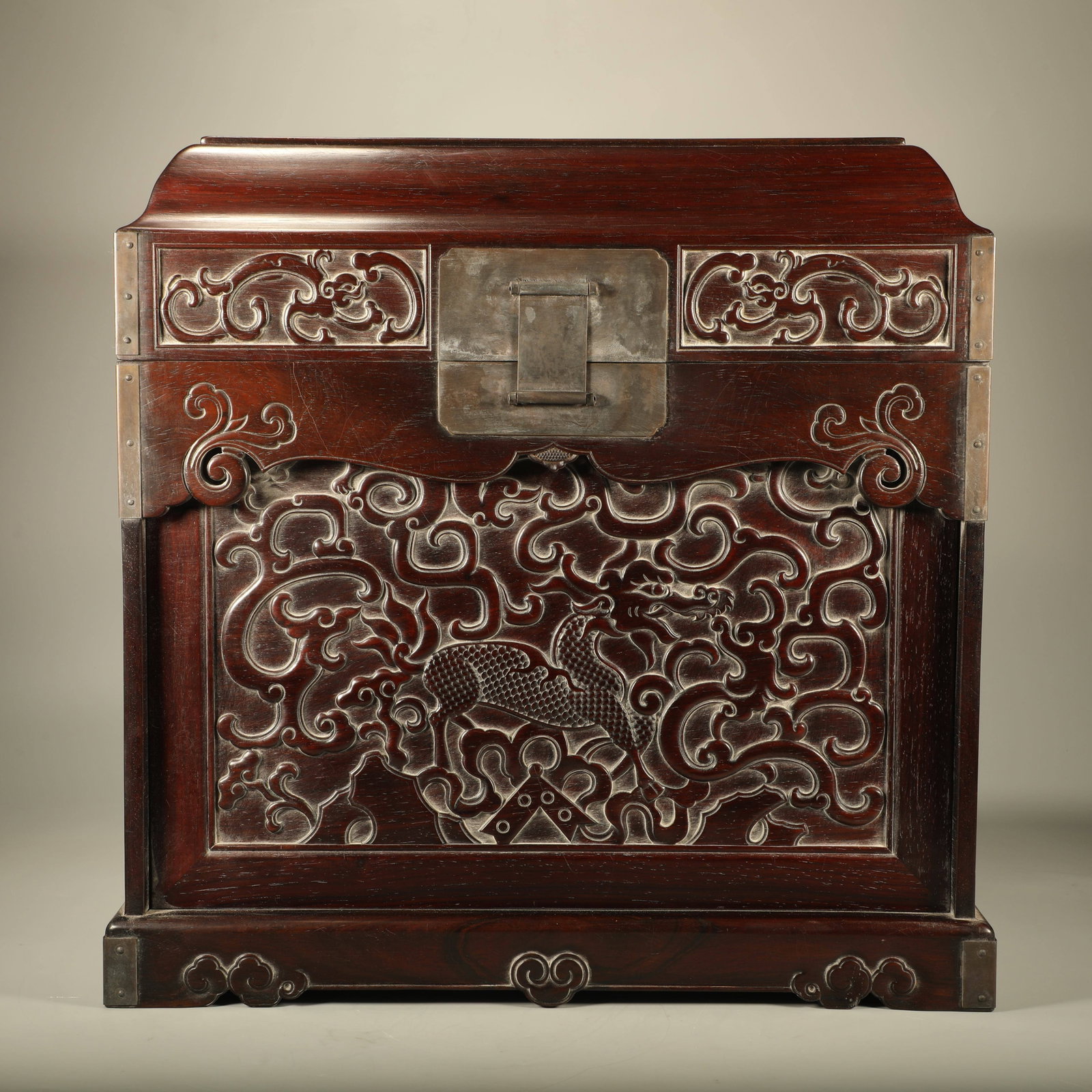 A HUANGHUALI OFFICIAL CHEST CARVED WITH QILIN AND DRAGON PATTERNS: Huanghuali Official Chest Carved with Qilin and Dragon Patterns
