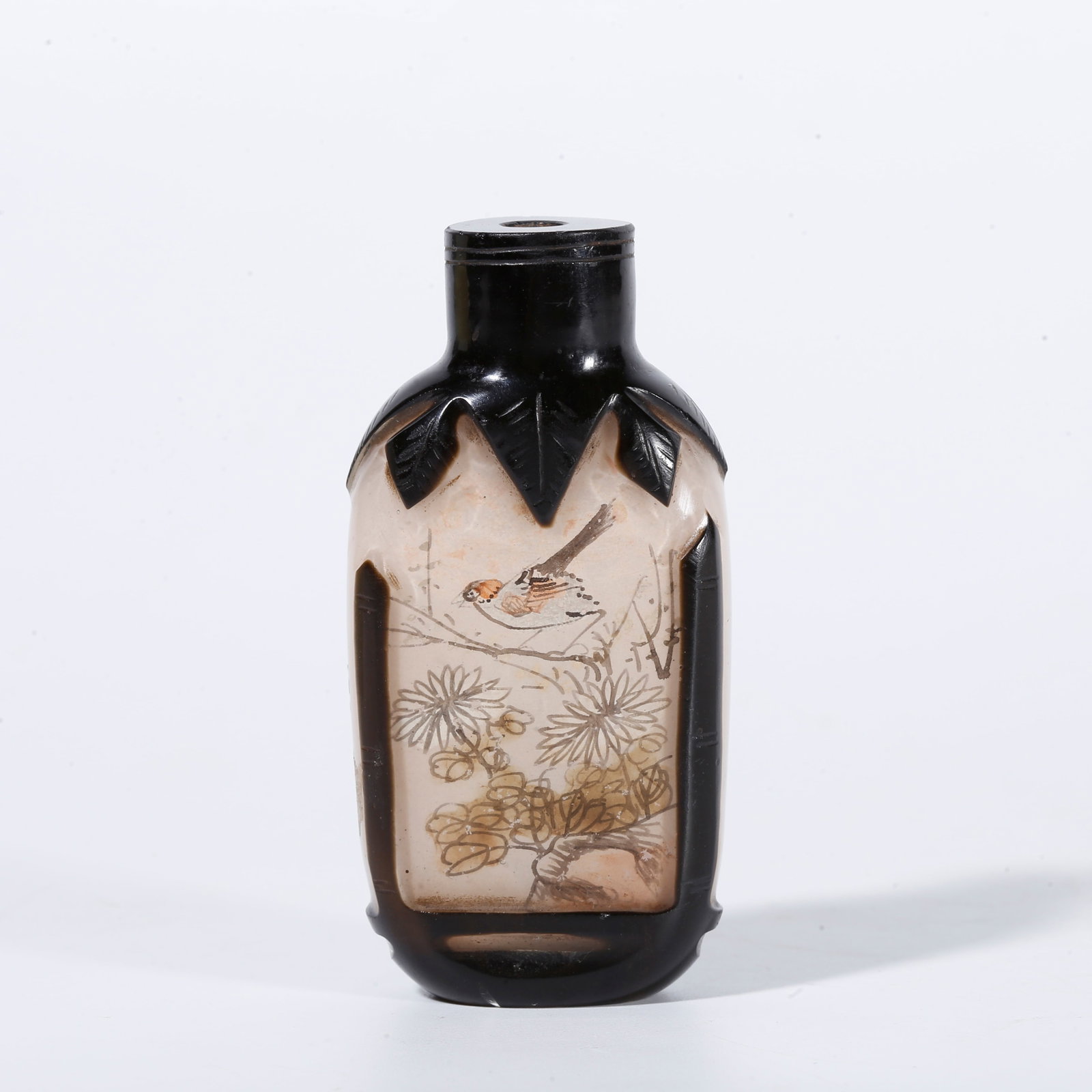 A CRYSTAL SNUFF BOTTLE WITH FLOWER AND BIRD MOTIF: Crystal snuff bottle with flower and bird motif