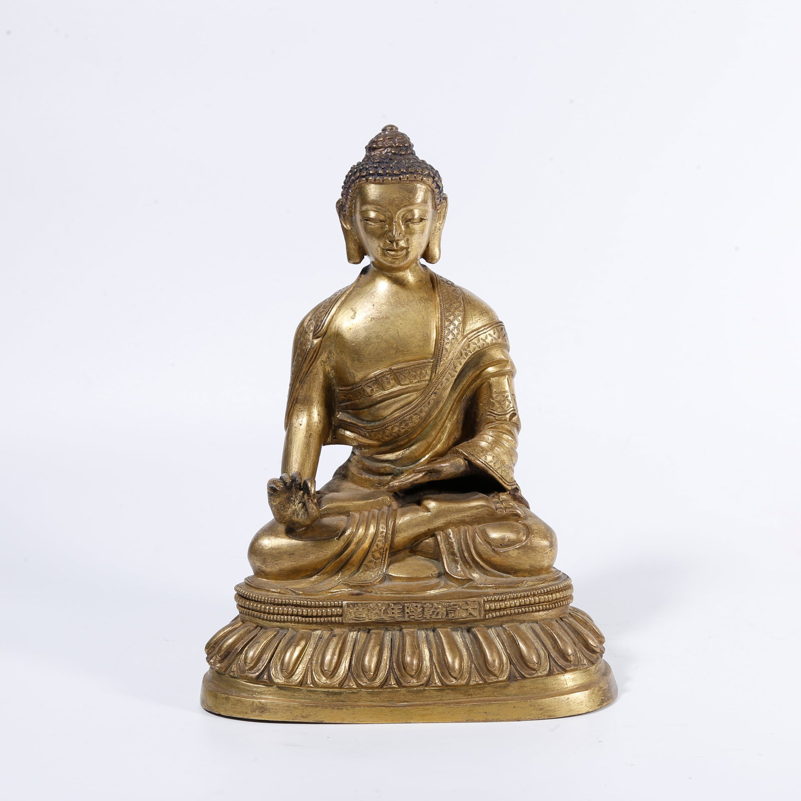 A GILT-BRONZE BUDDHA STATUE (1 of 9)