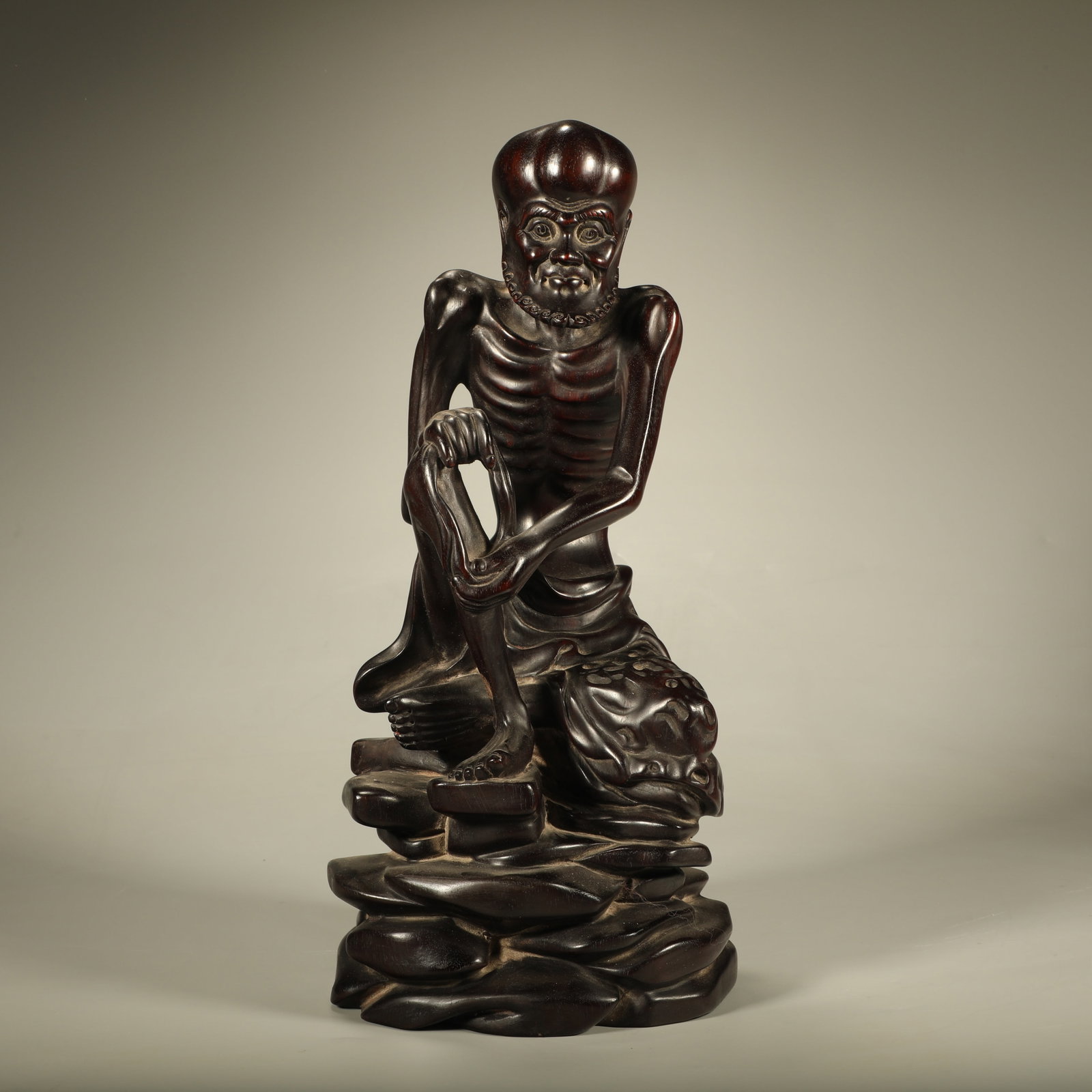 A SANDALWOOD CARVED SKELETAL ARHAT STATUE: Sandalwood Carved Skeletal Arhat Statue