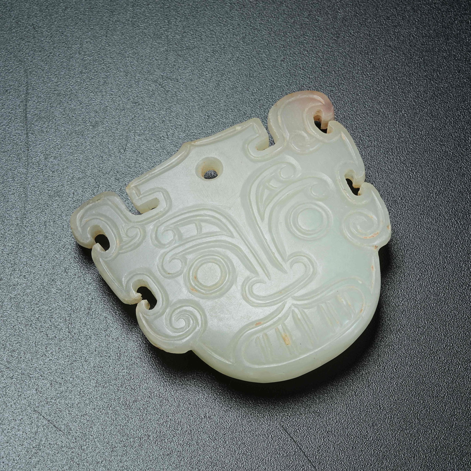 A ANCIENT JADE DIVINE MASK PENDANT: Ancient Jade Divine Mask Pendant