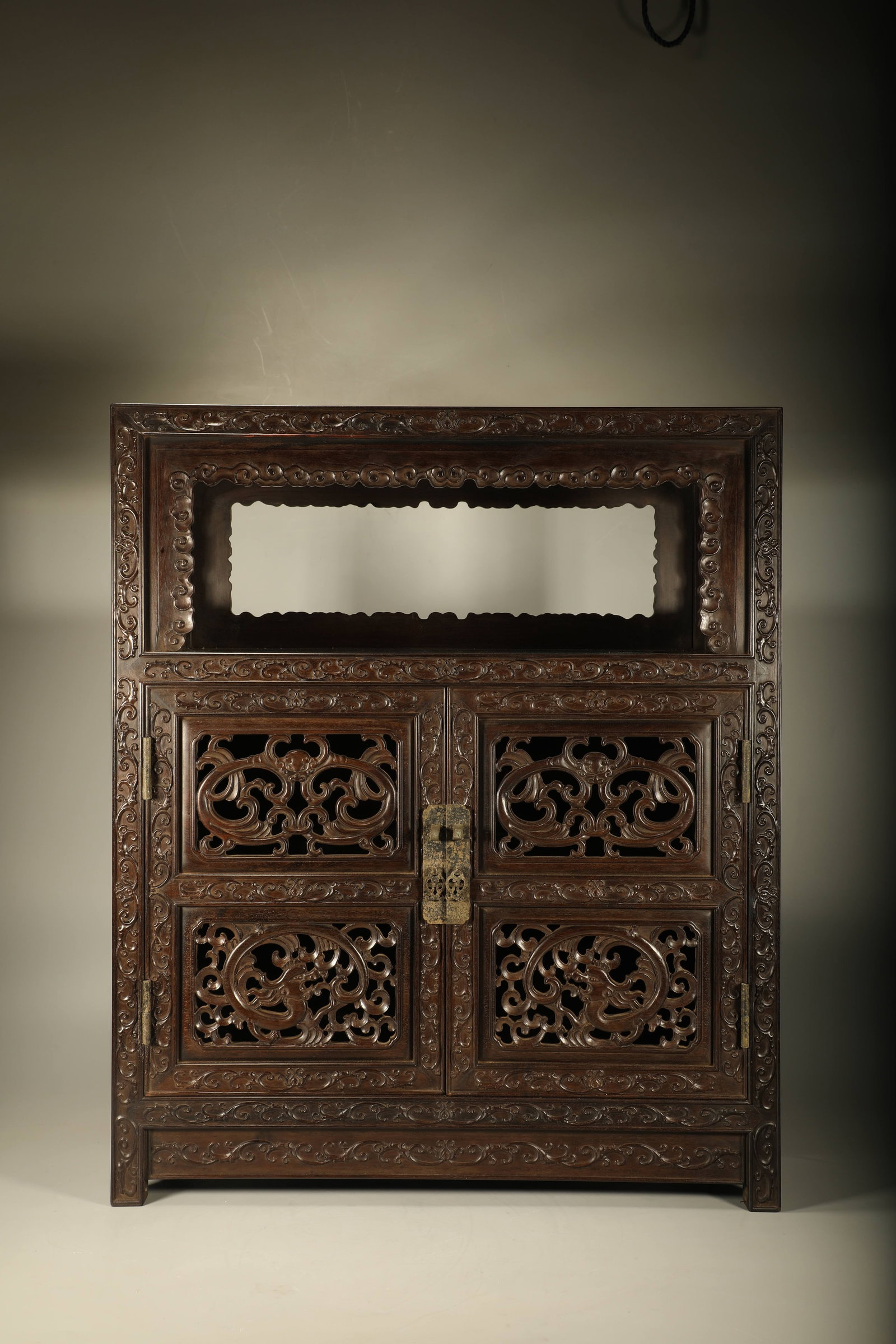 A SANDALWOOD TEA CABINET CARVED WITH DRAGON AND FLORAL PATTERNS (1 of 6)
