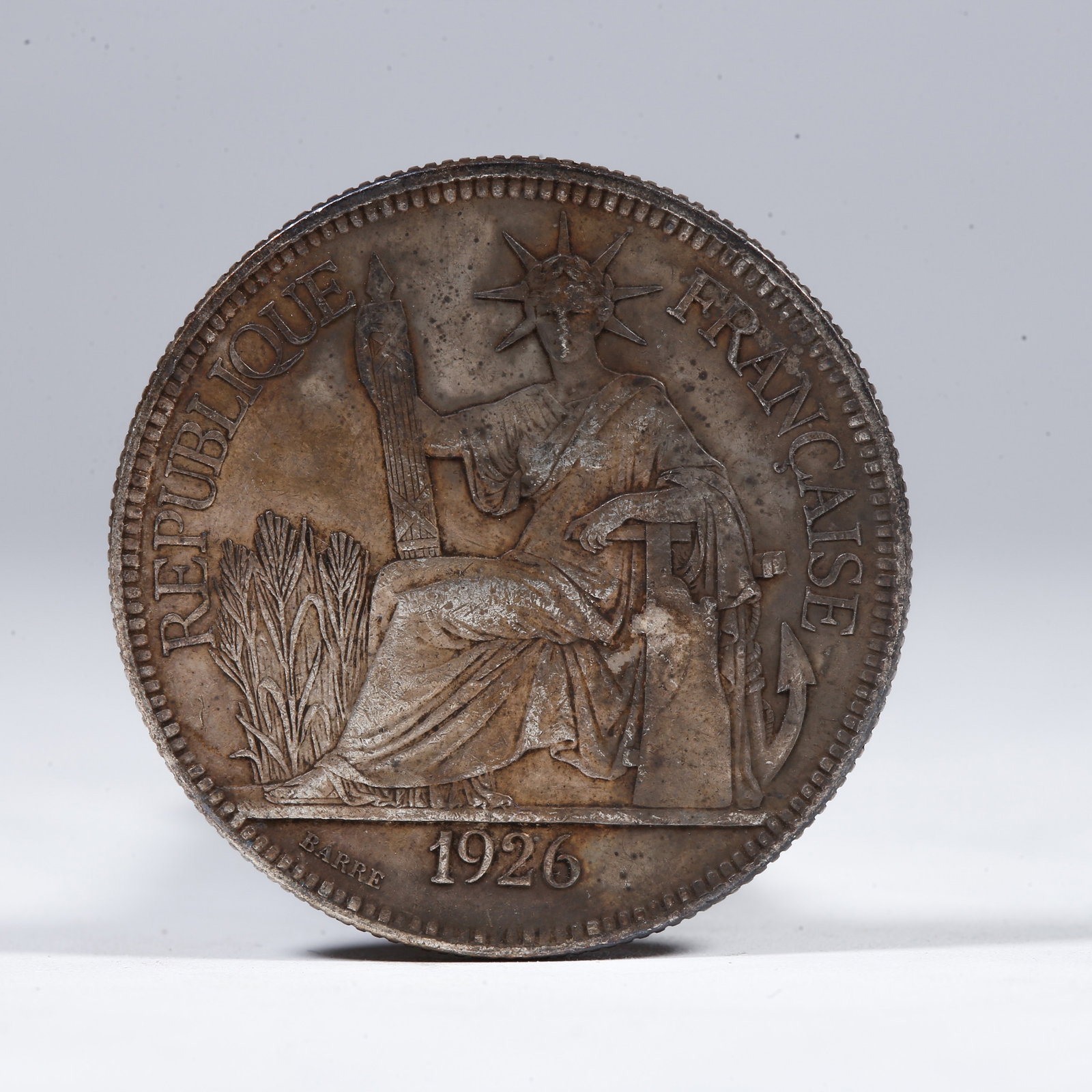 A SILVER DOLLAR COIN: One Silver Dollar Coin