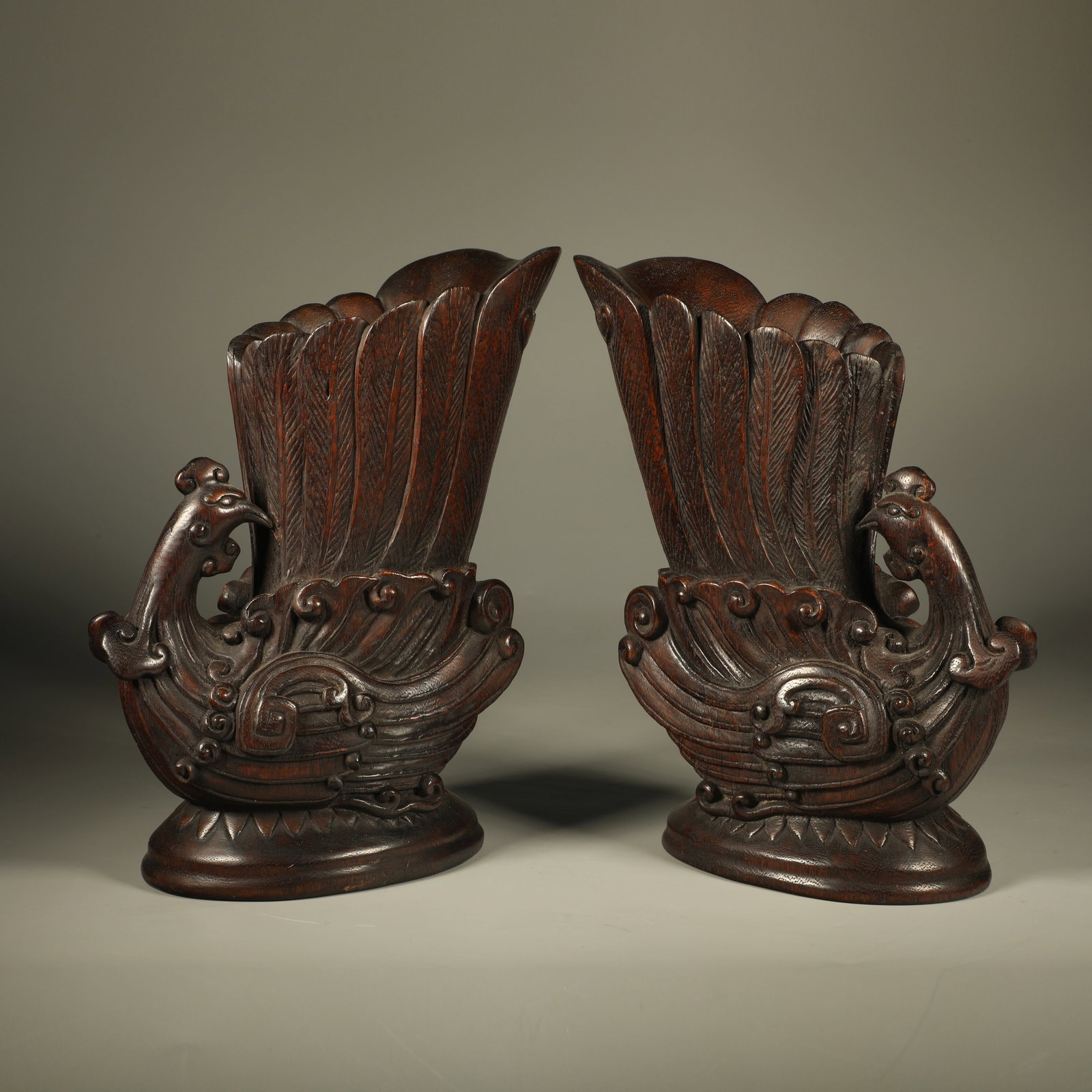 A PAIR OF CHENXIANG CUPS CARVED WITH PHOENIX PATTERNS: Pair of Chenxiang Cups Carved with Phoenix Patterns