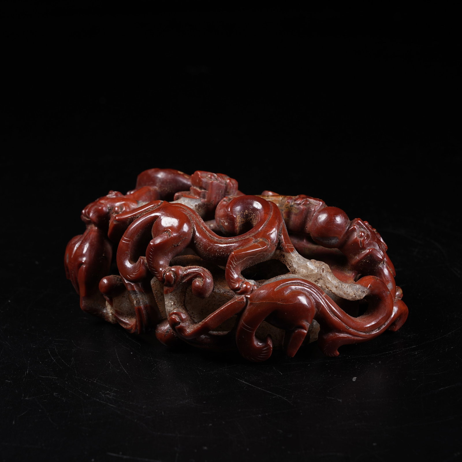 A WARRING STATES RED AGATE HEART-SHAPED PENDANT WITH CHI DRAGON PATTERN (1 of 8)