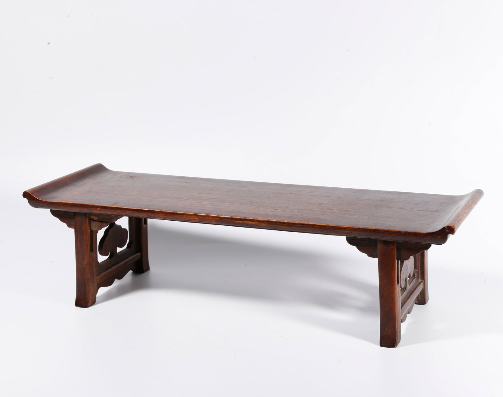 A RECESSED-END SIDE TABLE OF HUANGHUALI WOOD: Recessed-end side table of huanghuali wood