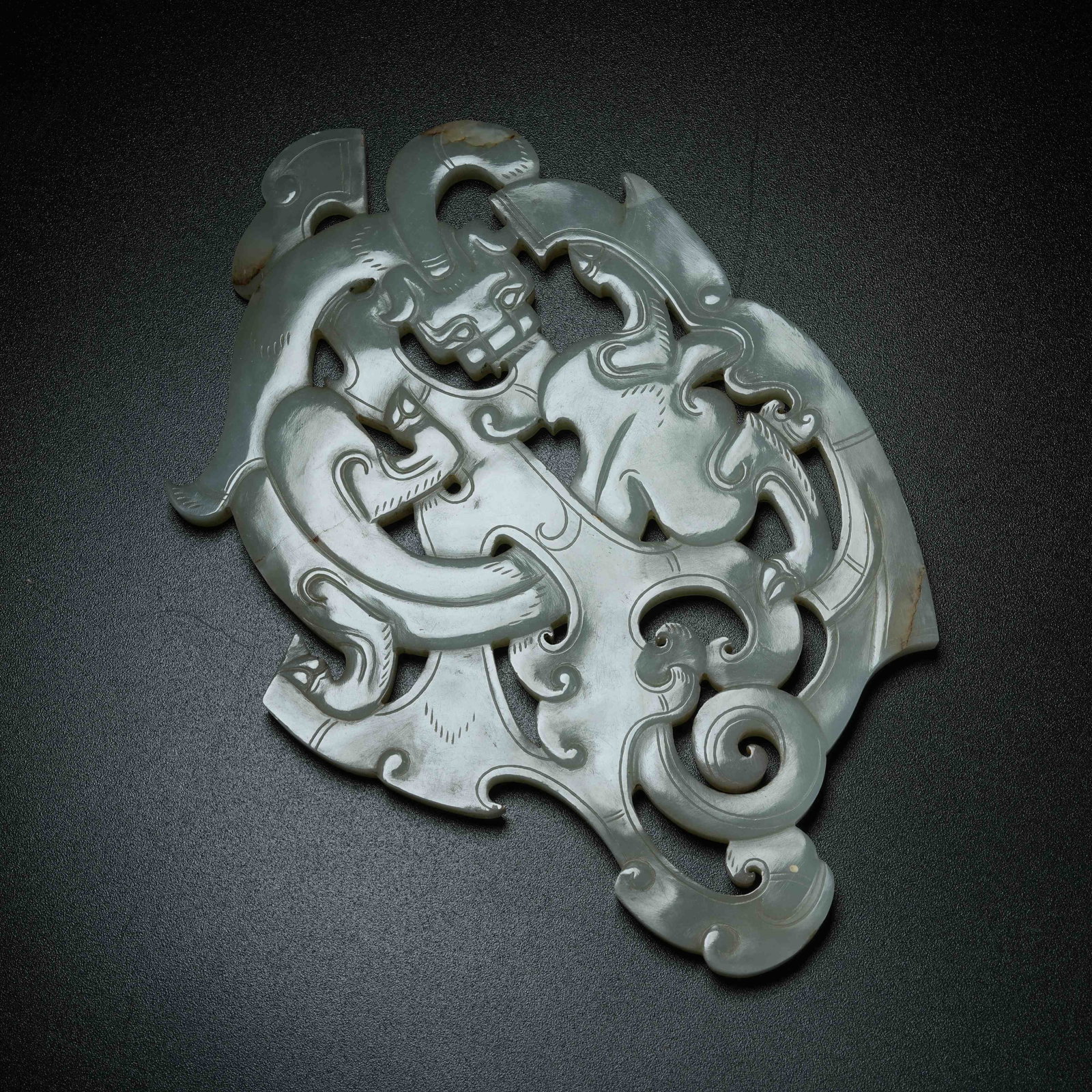 A ANCIENT JADE S-SHAPED DRAGON PENDANT: Ancient Jade S-shaped Dragon Pendant