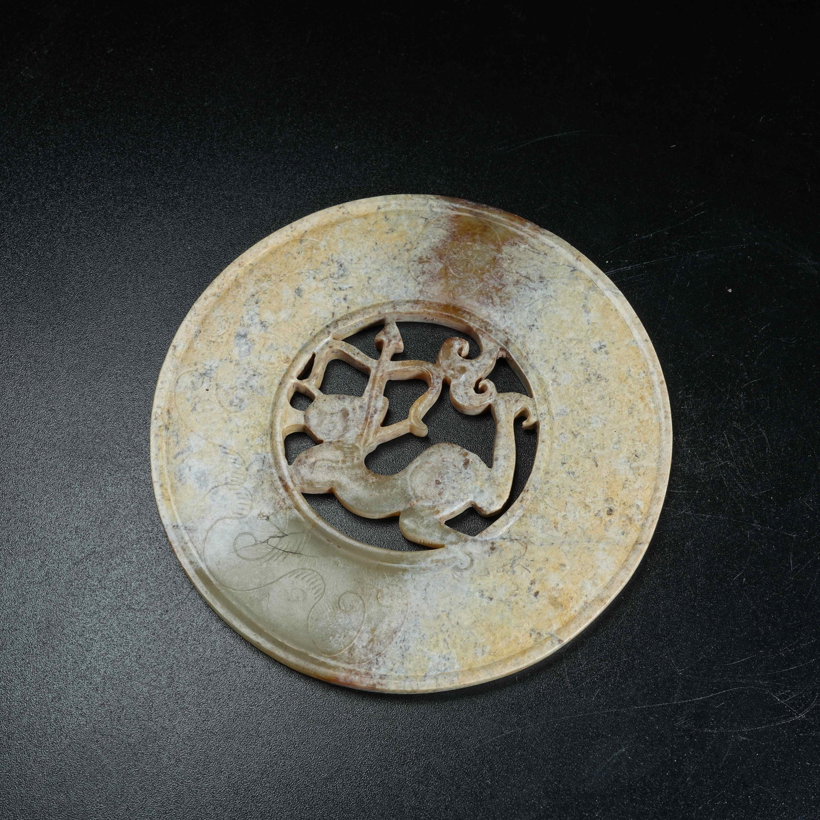 A ANCIENT JADE BI DISC CARVED WITH HUNTING SCENES (1 of 9)