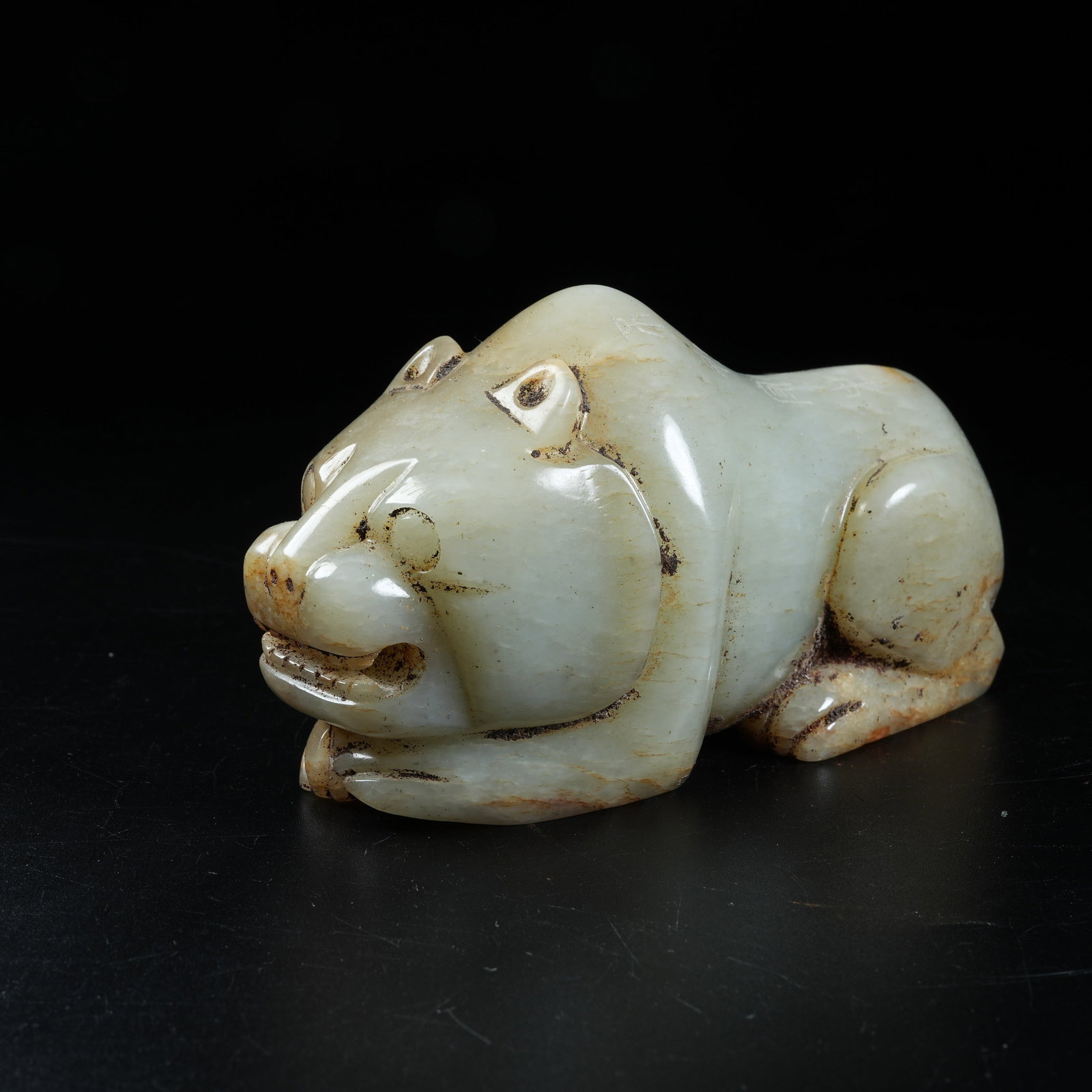 A ANCIENT JADE RECLINING BEAR ORNAMENT (1 of 8)