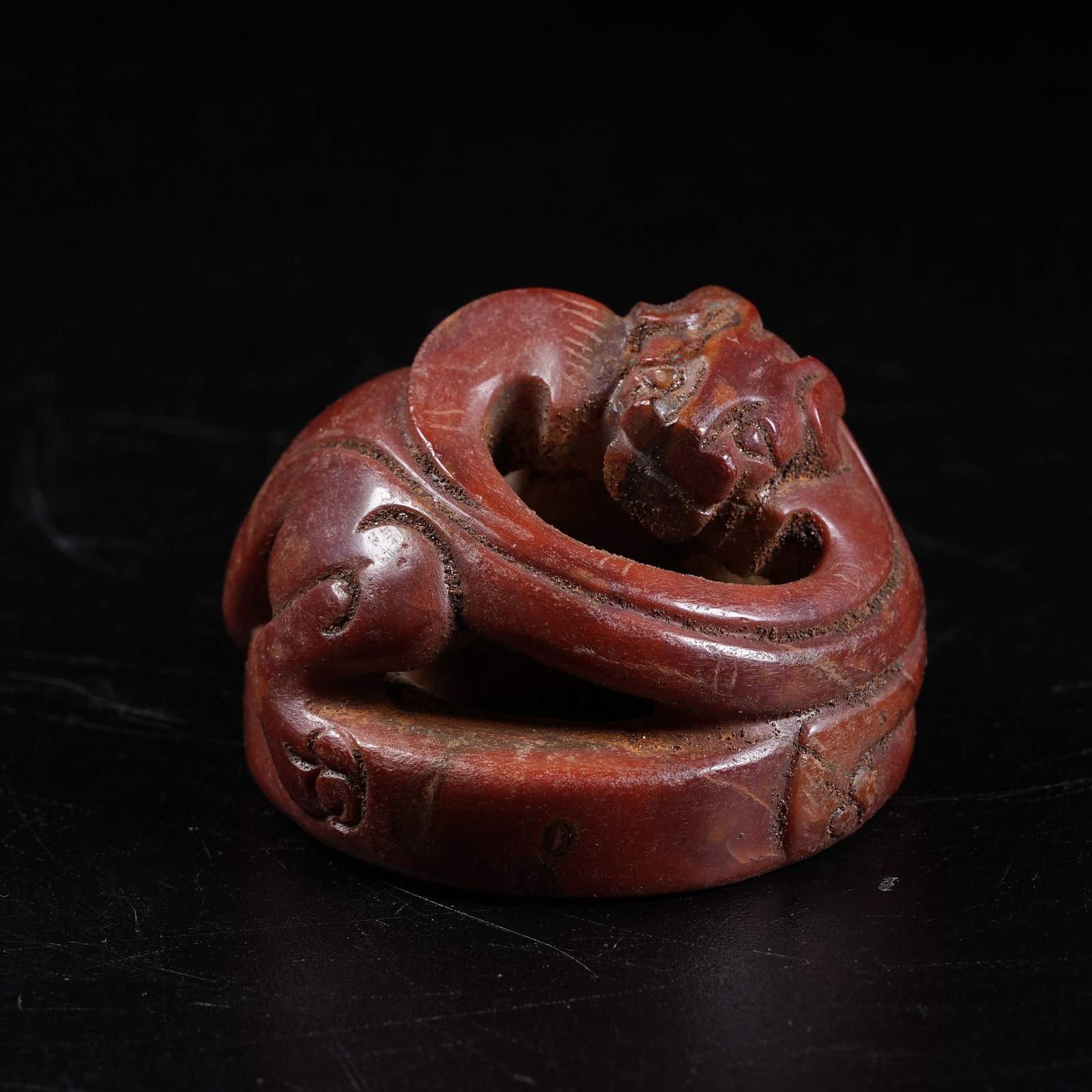 A WARRING STATES RED AGATE CHI DRAGON ORNAMENT (1 of 8)