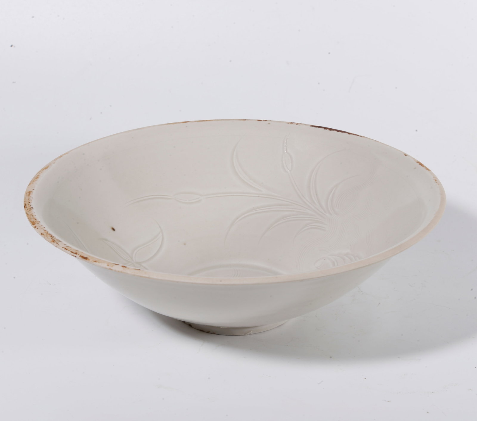 A DING KILN BOWL WITH REED AND WILD GOOSE MOTIF: Ding kiln bowl with reed and wild goose motif