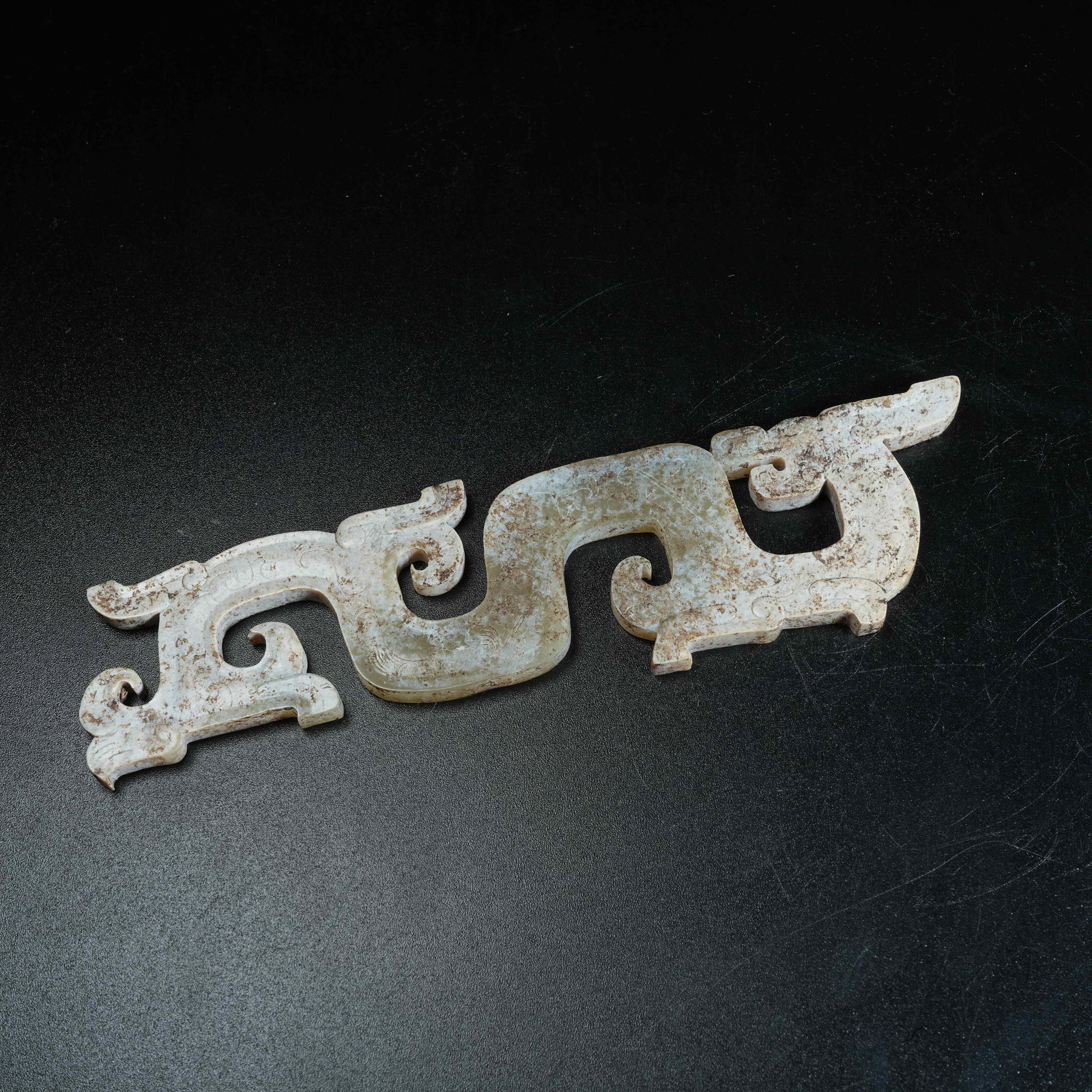 A ANCIENT JADE S-SHAPED DRAGON PENDANT: Ancient Jade S-shaped Dragon Pendant