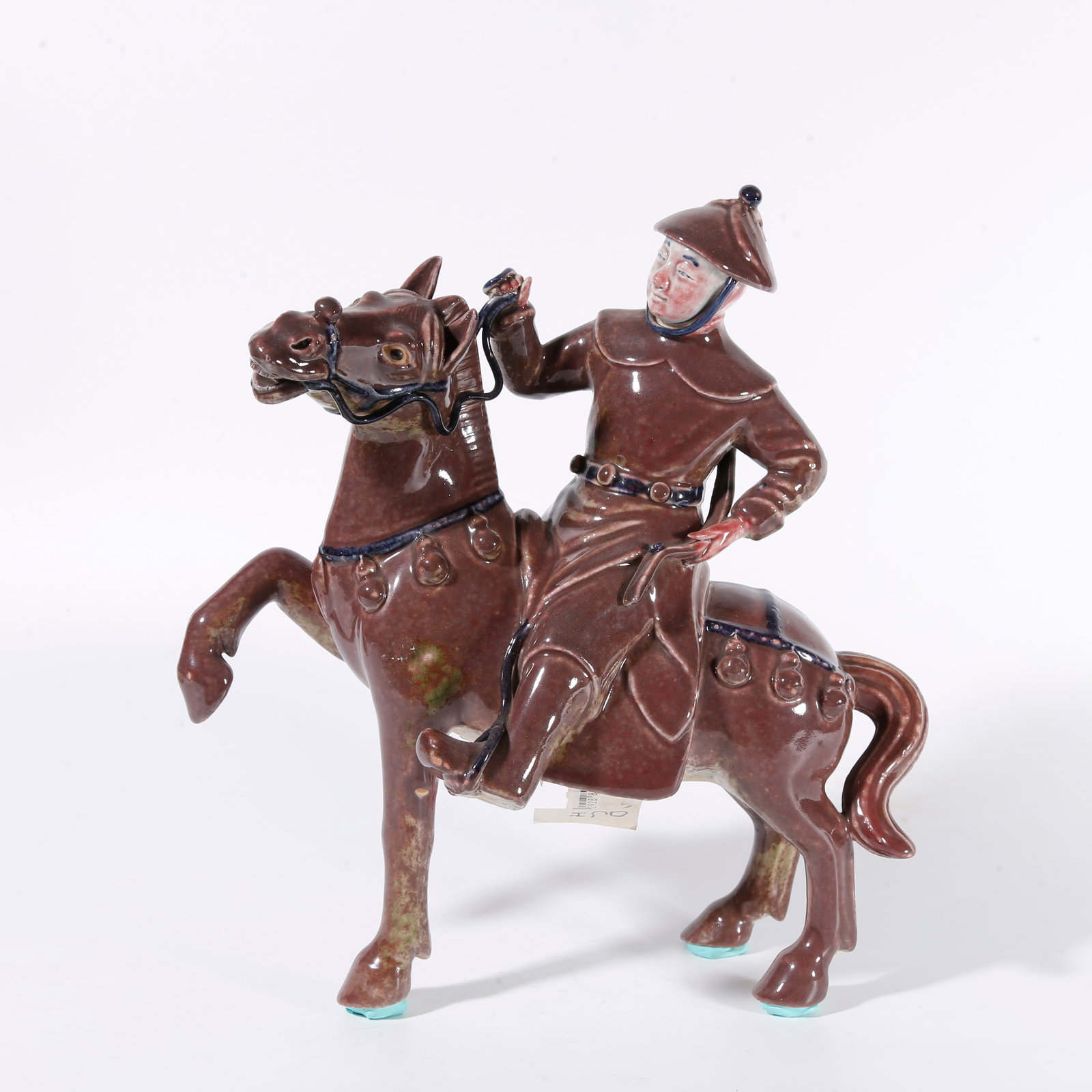 A RED-GLAZED ORNAMENT OF HORSEMAN (1 of 10)